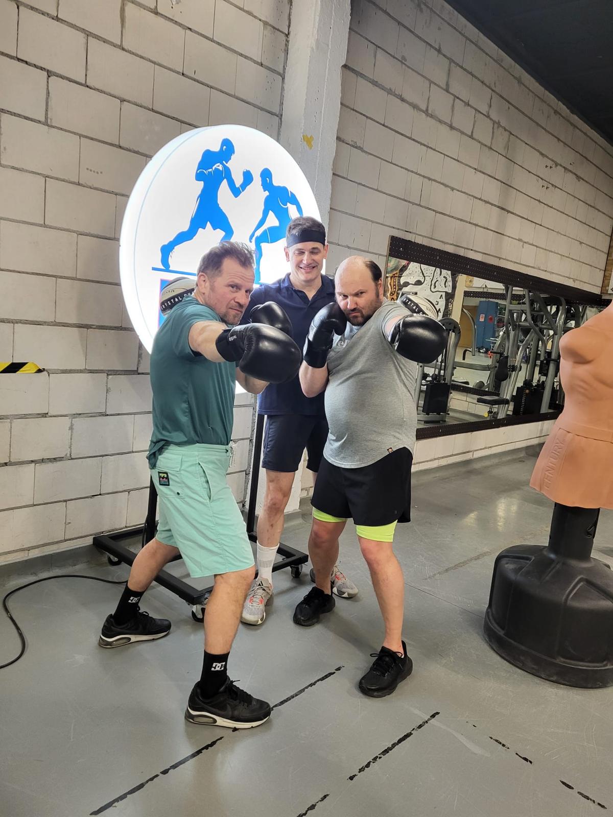 People boxing each other