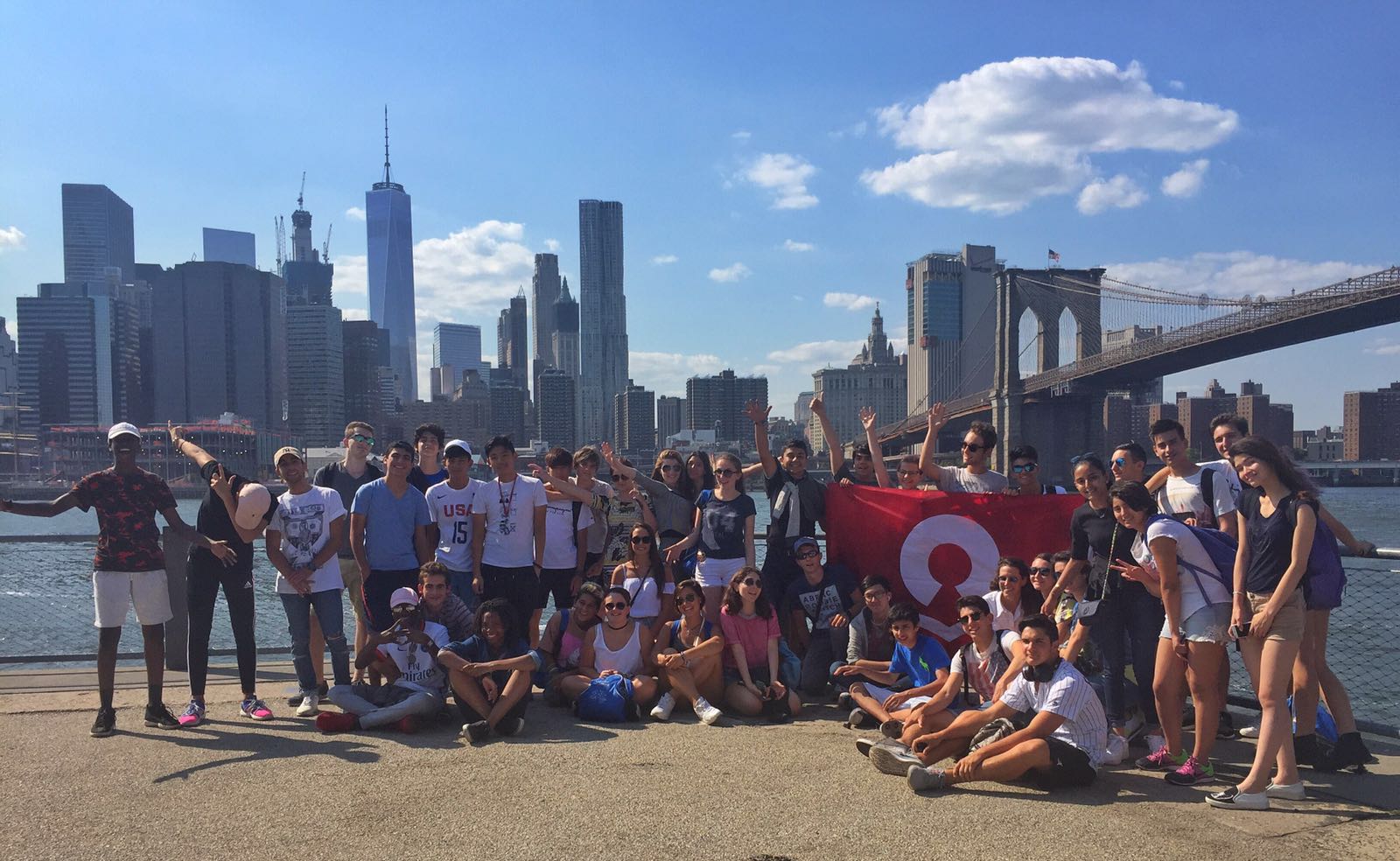 two men and a woman looking out at the ocean