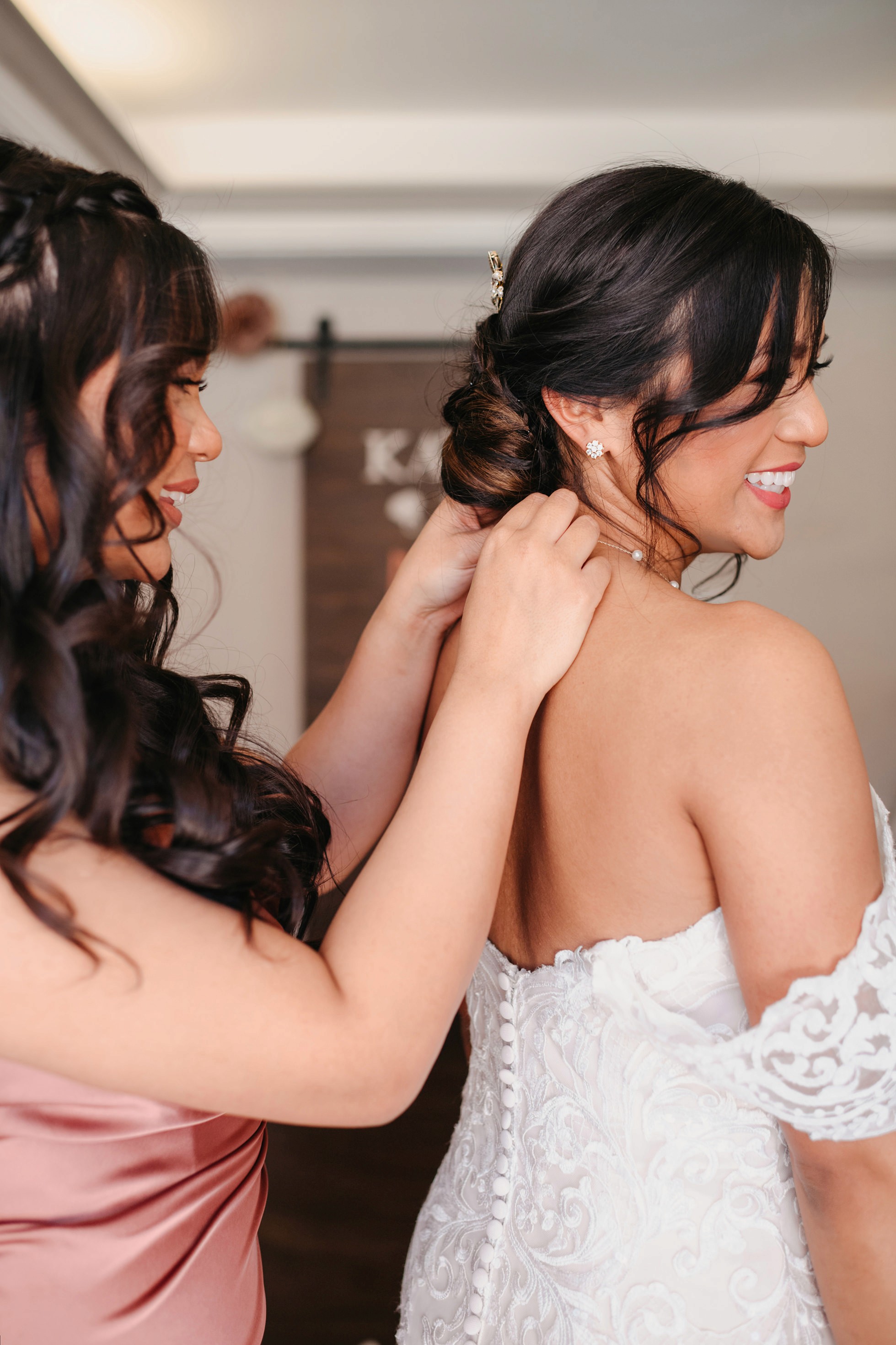 Flat lay wedding details with bouquet, rings, and sparkling bridal heels