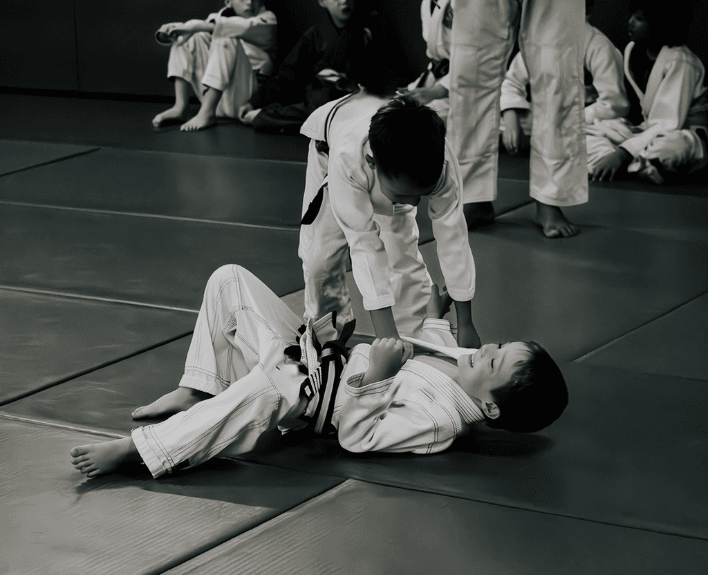 Two students drilling a ground technique during Jiu Jitsu training