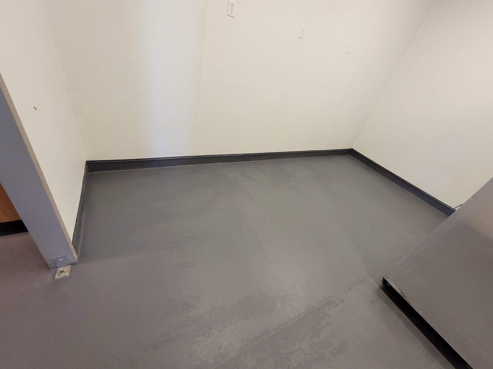 Bright, finished Eco-Grip floor showing consistent color and a smooth, durable surface throughout the workspace.