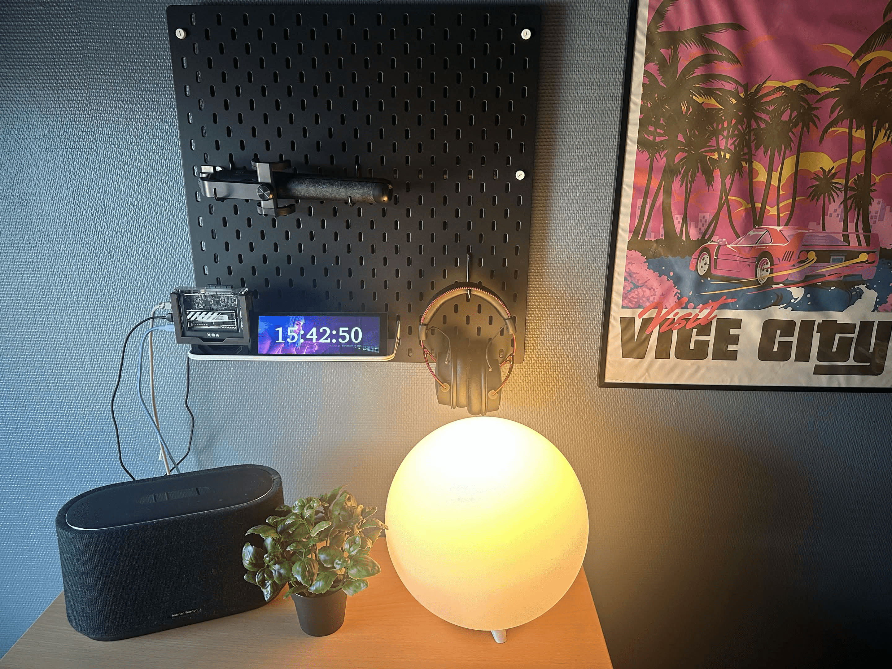GOverlay Plus beside a ZimaBlade, gaming headset and Google Home on a black IKEA Skådis.