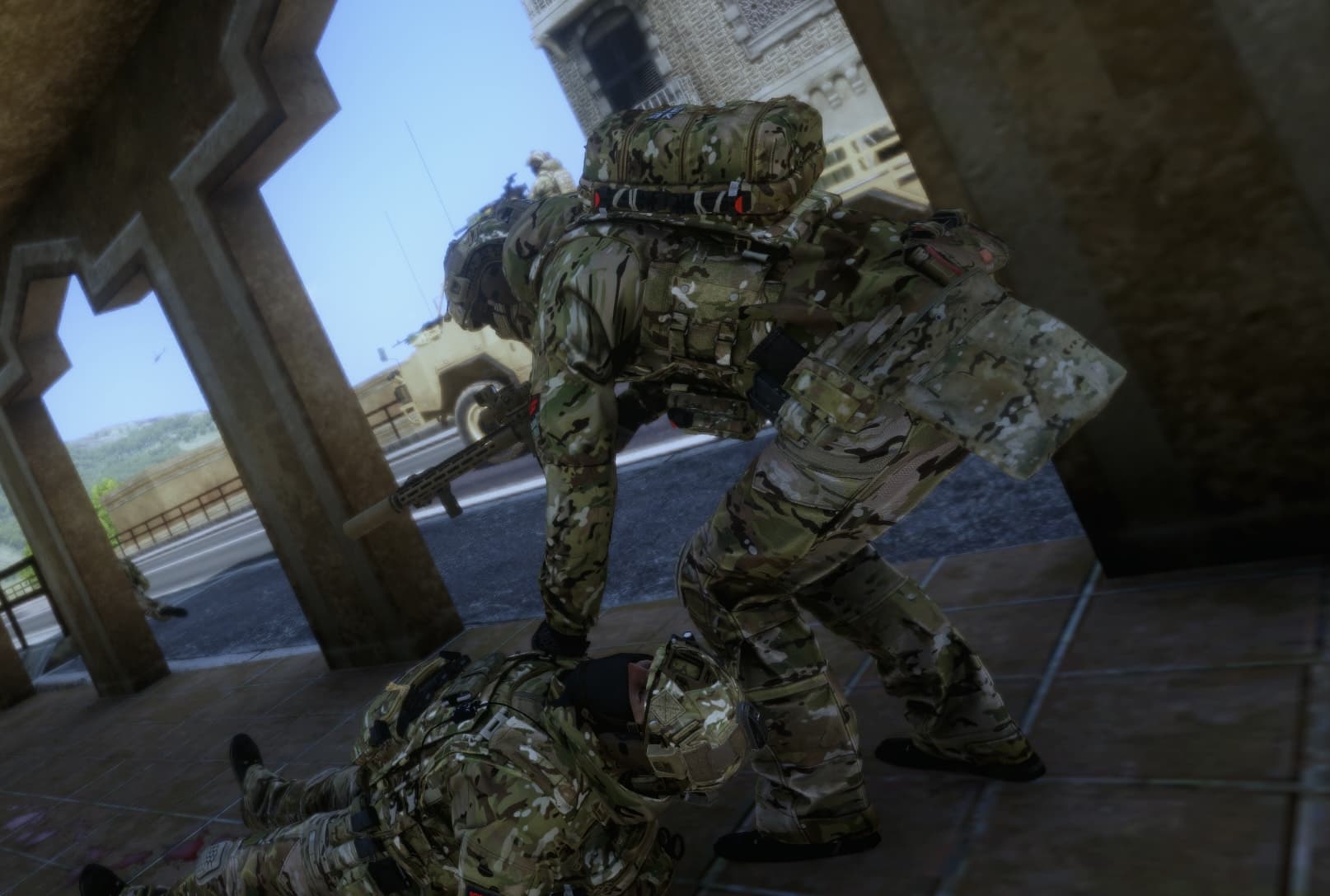 The Regimental Aid Post, Royal Marine Commando, dragging a casualty to saftey under fire, with terrain resembling rural afghanistan