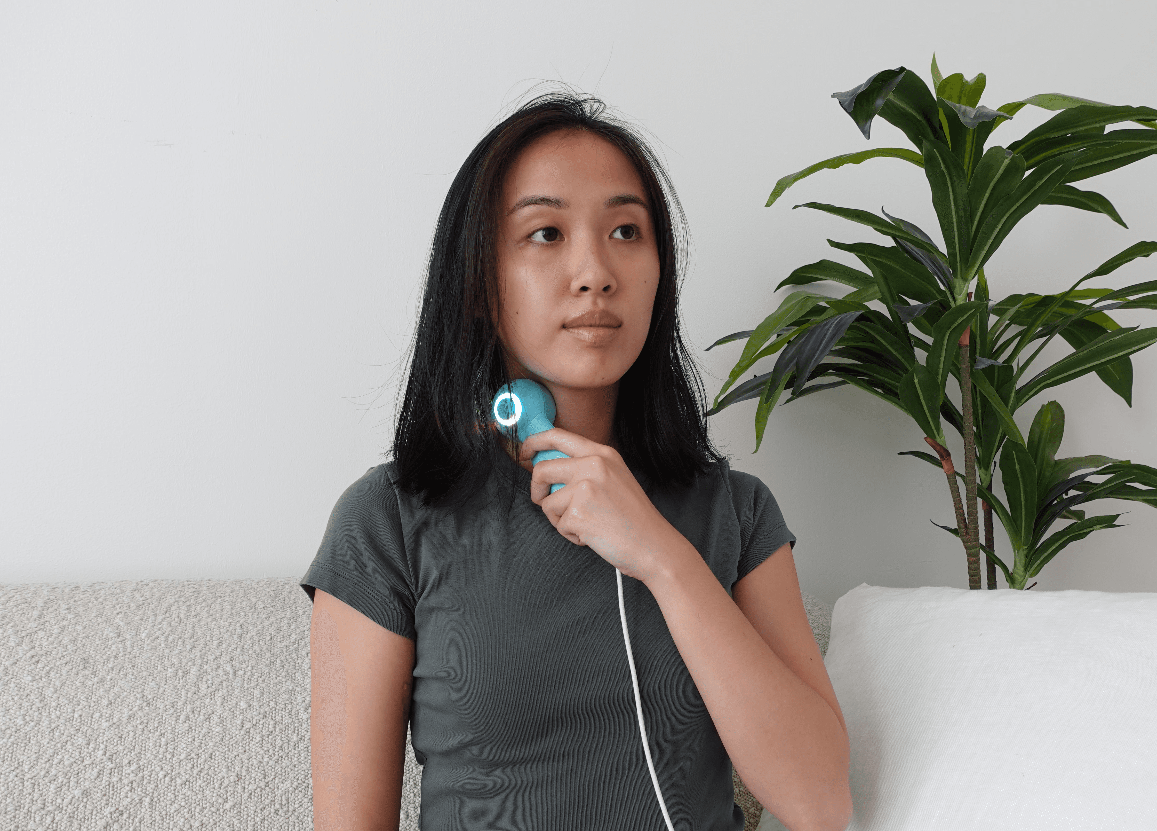 Two people looking at a laptop screen together.