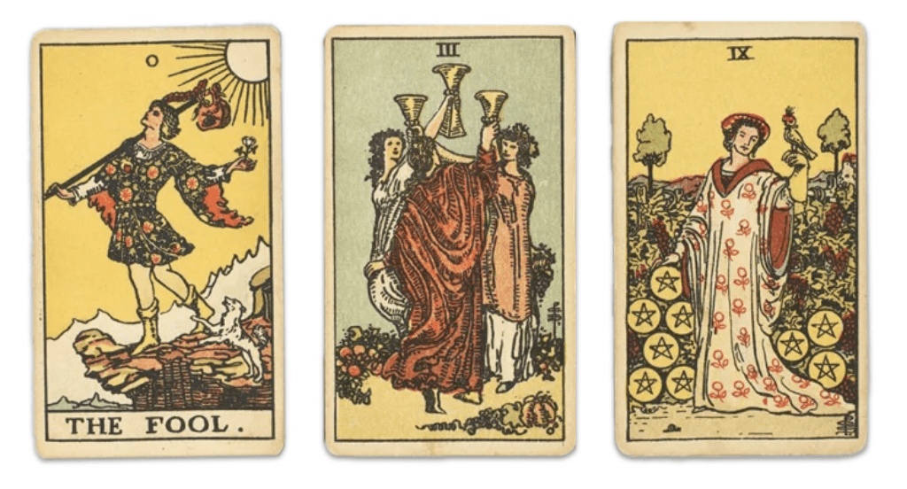 Three Rider-Waite tarot cards laid side by side: The Fool (card 0), Three of Cups, and Nine of Pentacles.