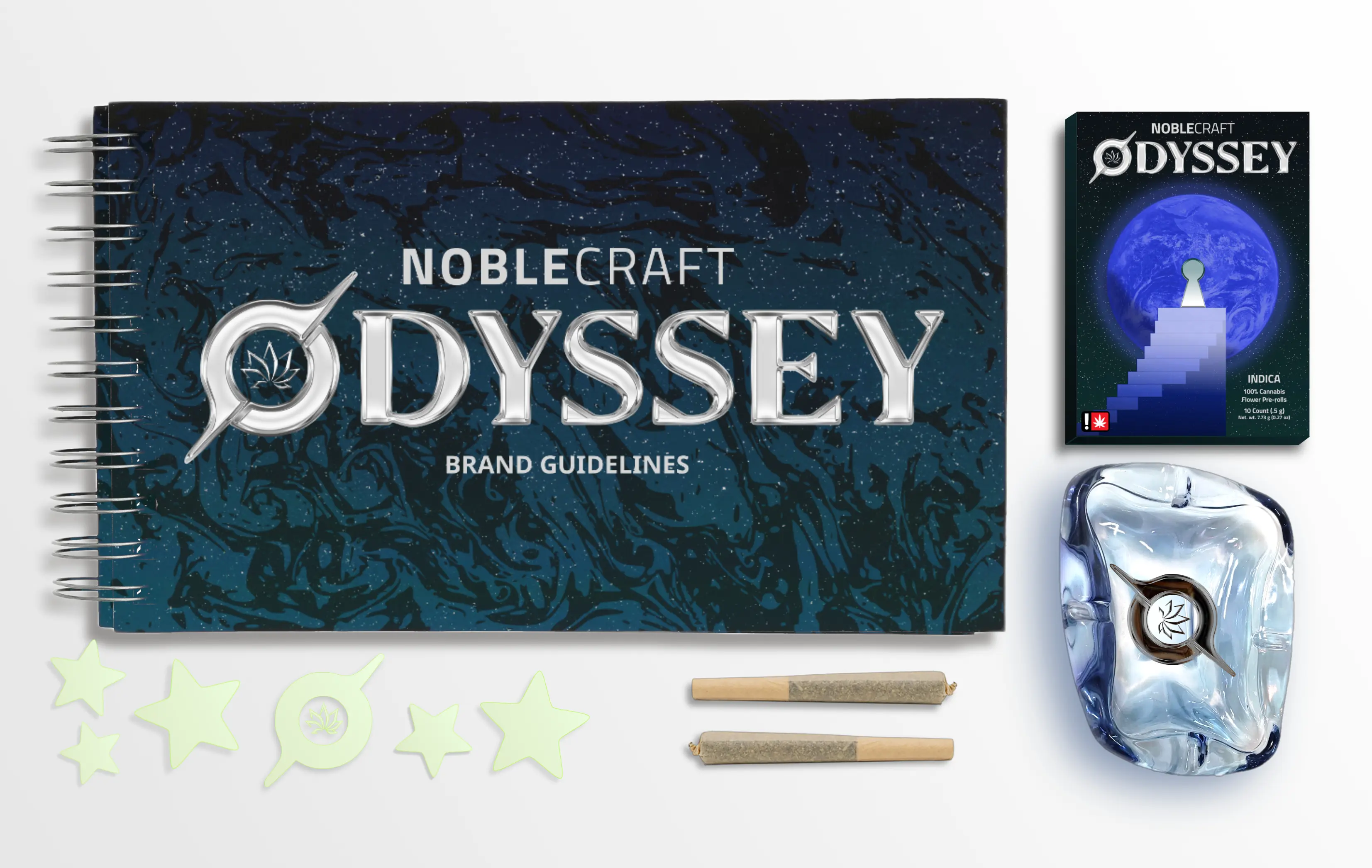 Flatlay of Noblecraft Odyssey brandbook and cannabis packaging