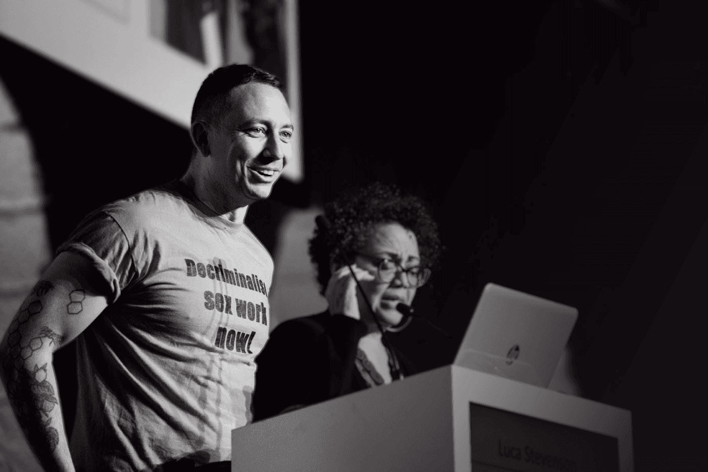 Man speaking at a podium