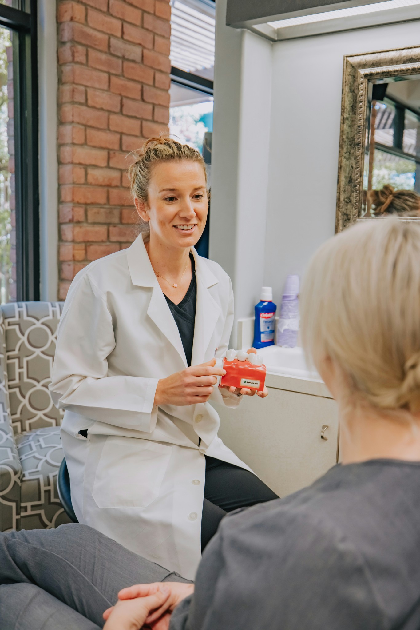 Dentist discussing smile improvement with patient