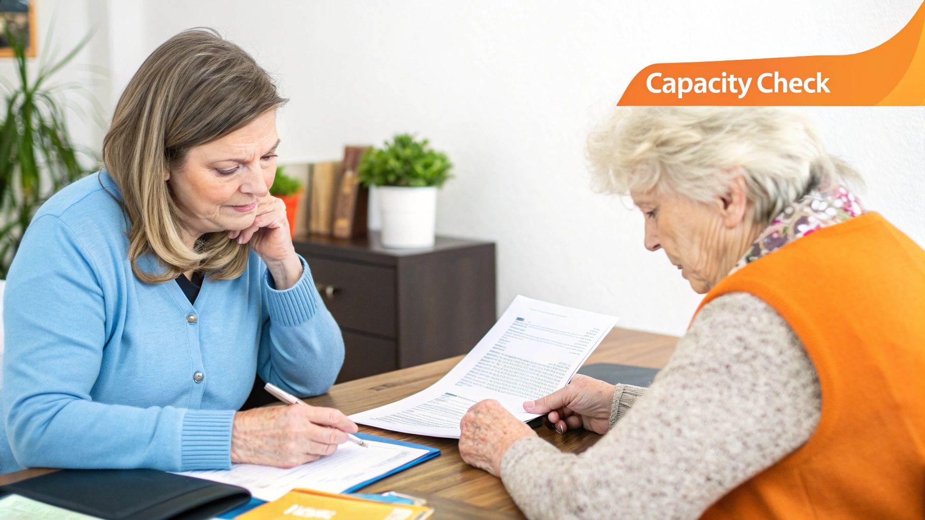A compassionate healthcare professional talking with an elderly patient in a well-lit room.