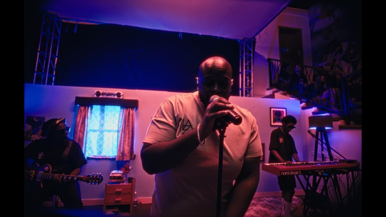 A man rapping into a microphone 