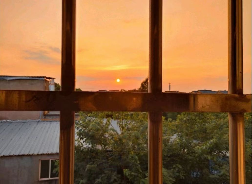 a blurry photo of a person standing in front of a wall