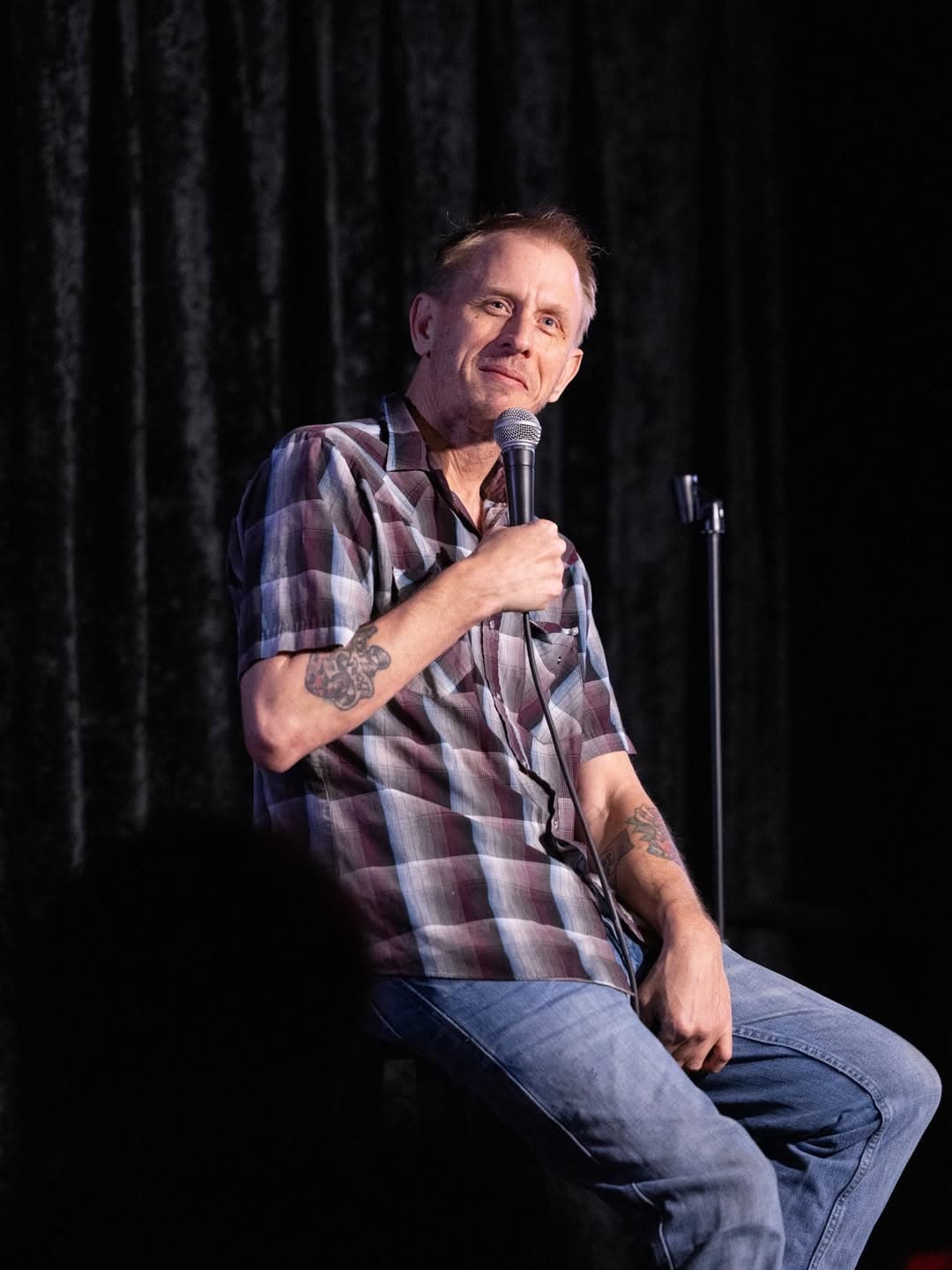 Davey Wester performing Stand Up Comedy sitting down