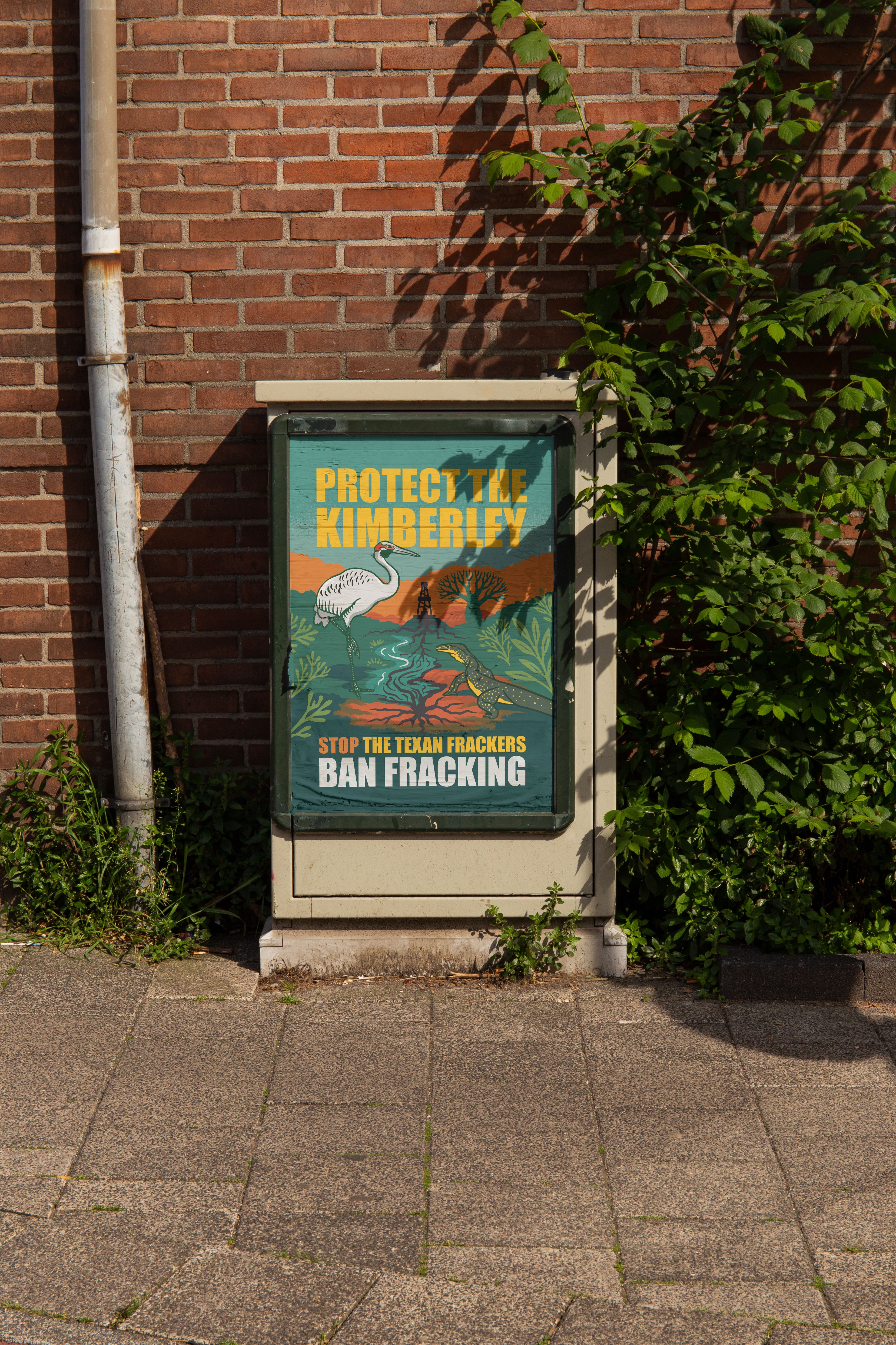 photo of Frack Free Kinberley illustrated and designed posters pasted on electrical box