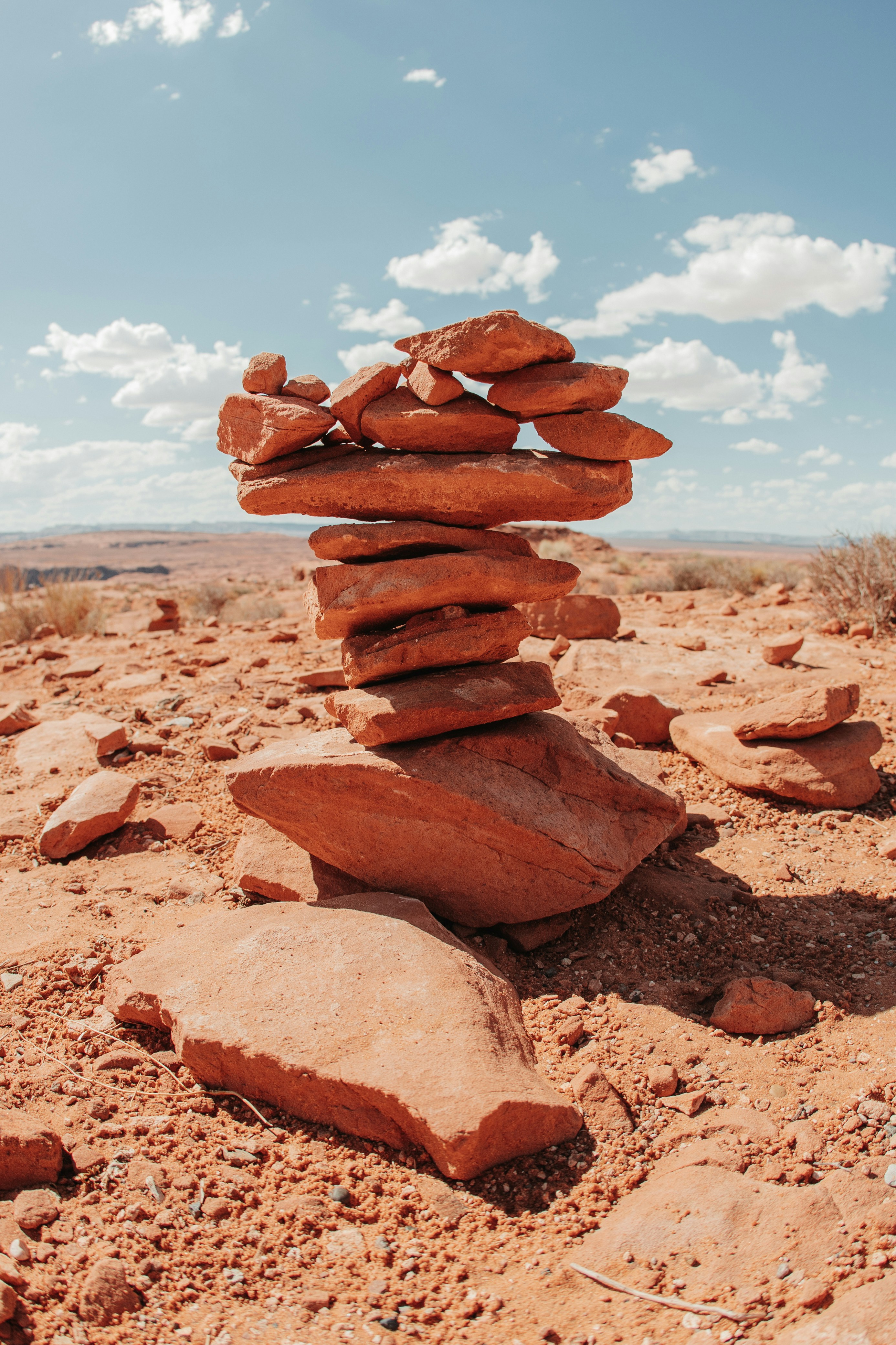 a pile of rocks sitting on top of a dirt field
