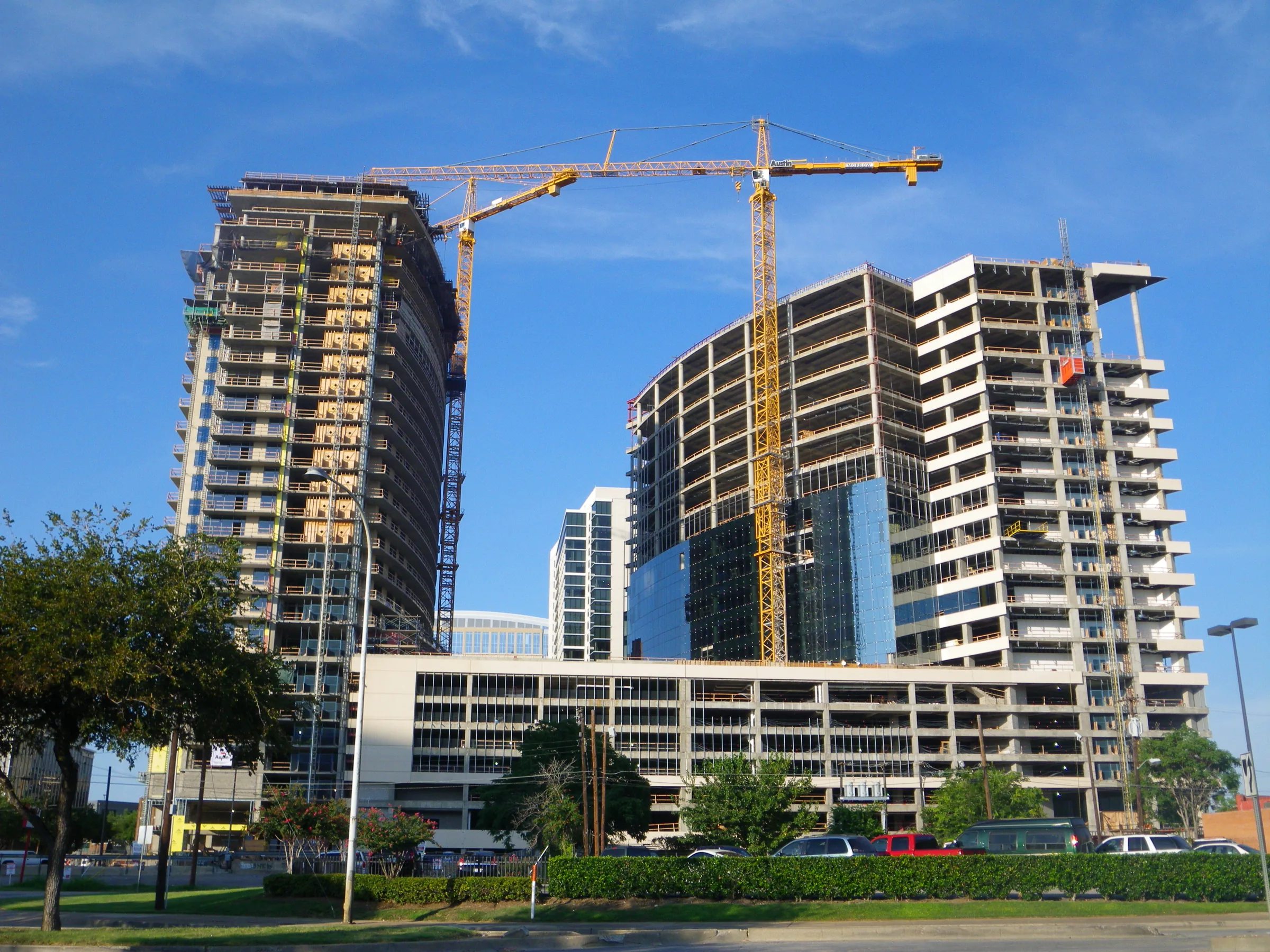 Liebherr tower cranes over towers under construction in Uptown Dallas