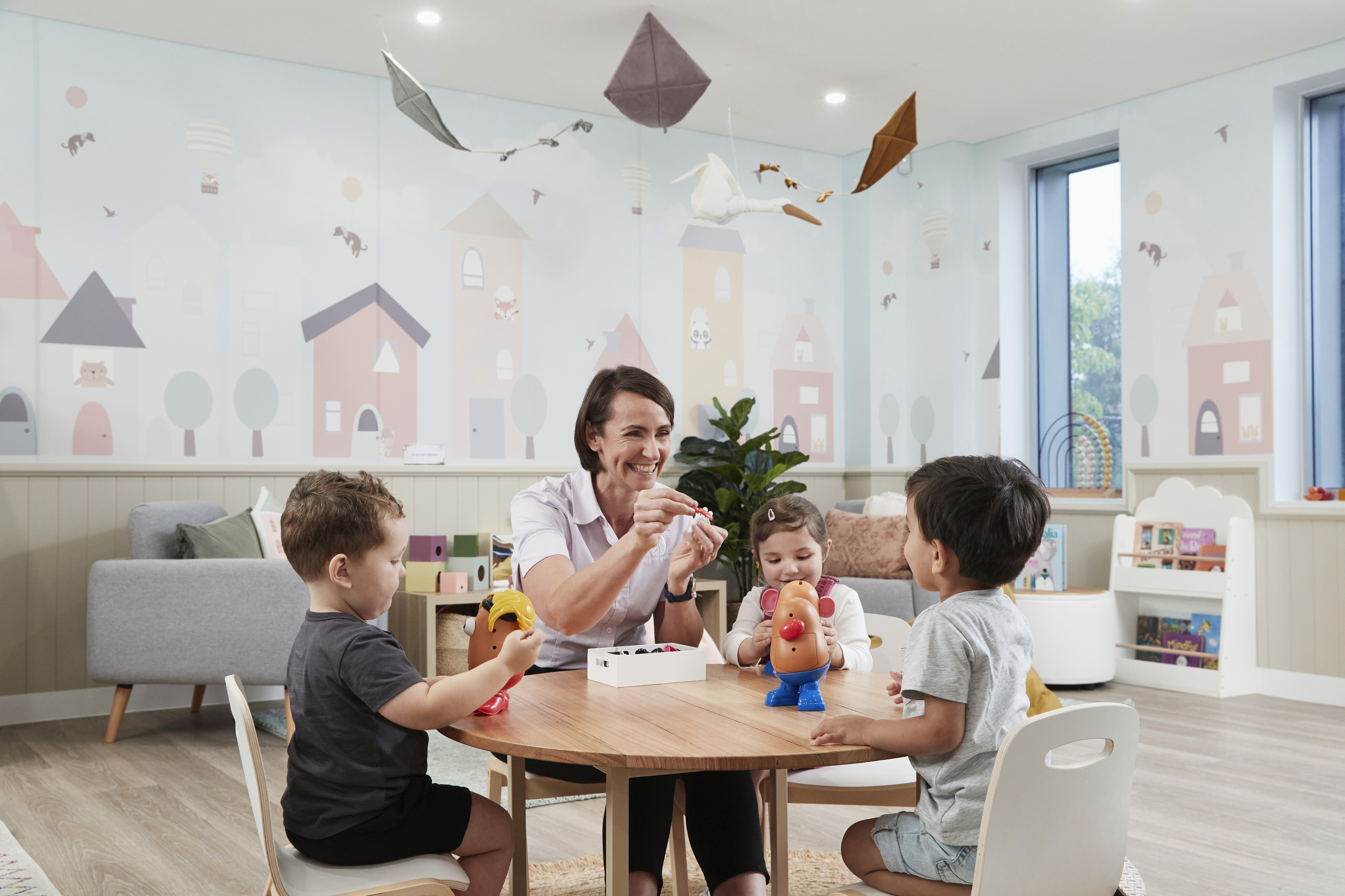 Close-up of a dark green leaf showing its textured surface and central vein against a muted background.