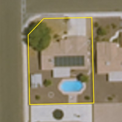 Aerial photo of a backyard pool in Yuma, with the lot outlined in yellow