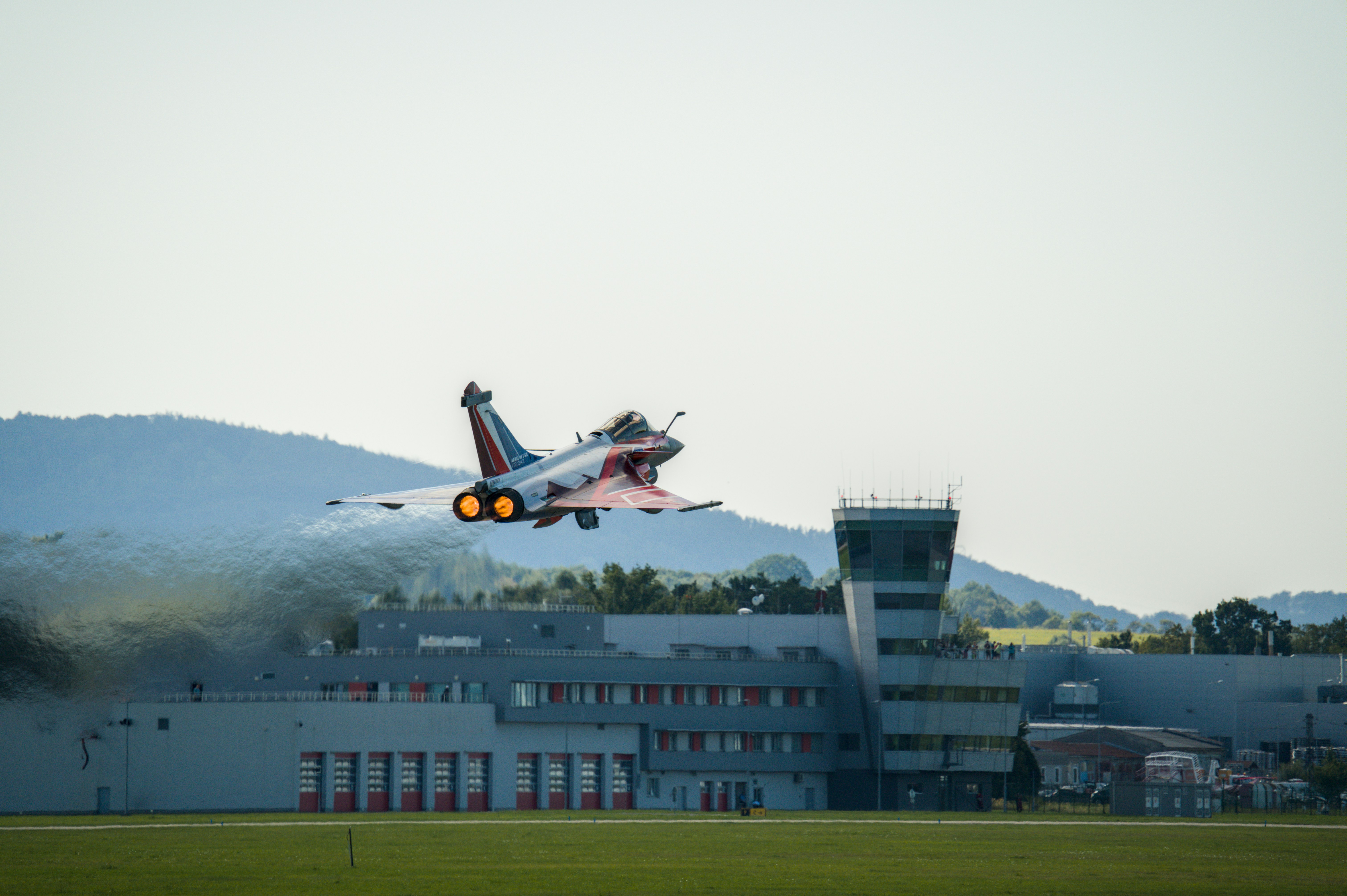 Fighter jet taking off from airport runway