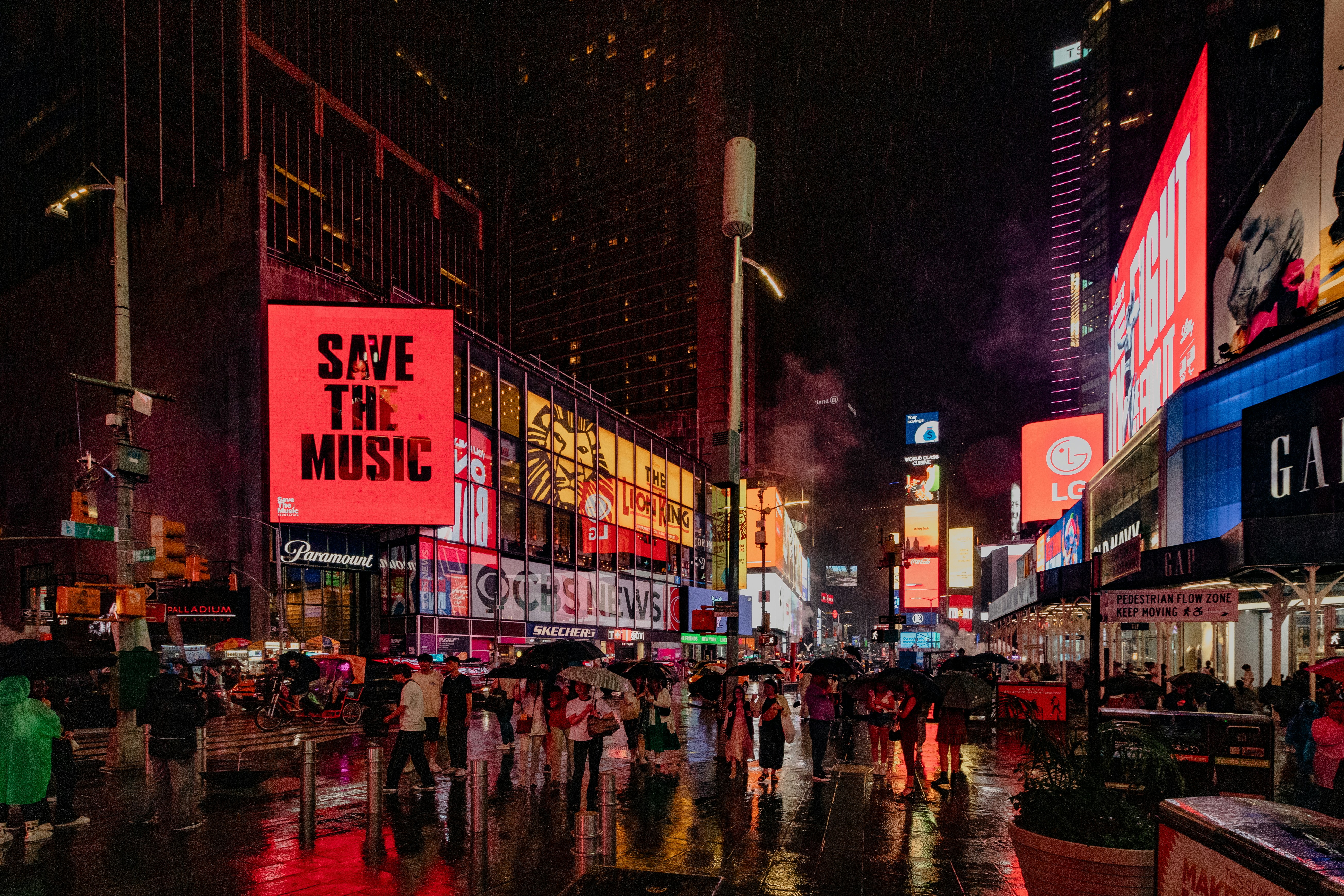 A city street filled with lots of tall buildings
