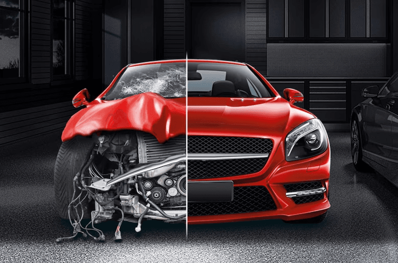 Picture of a red car in collision repair, half destroyed. 