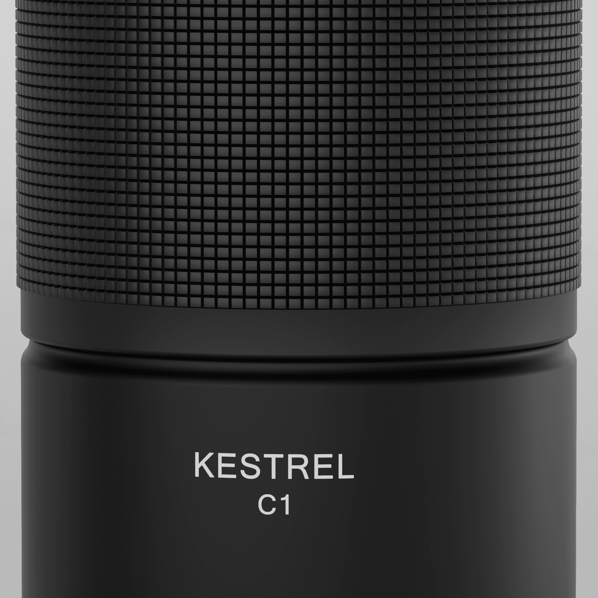 Close-up of the knurled grip meeting the smooth lower body, with each square of the knurl catching the light individually and white lettering engraved below.