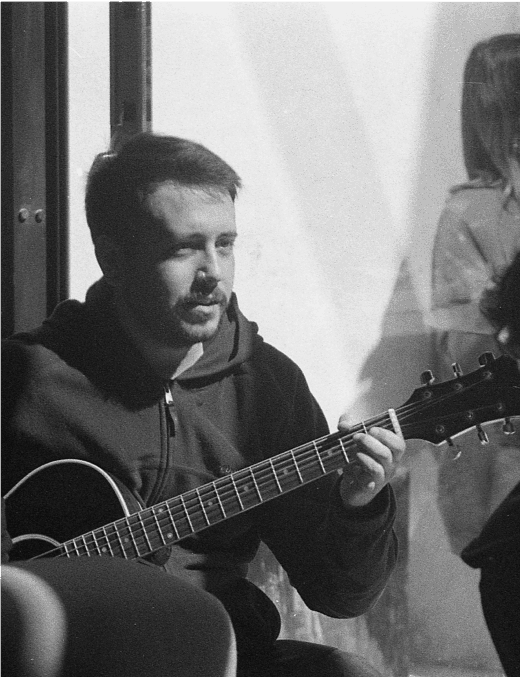 young man playing the guitar