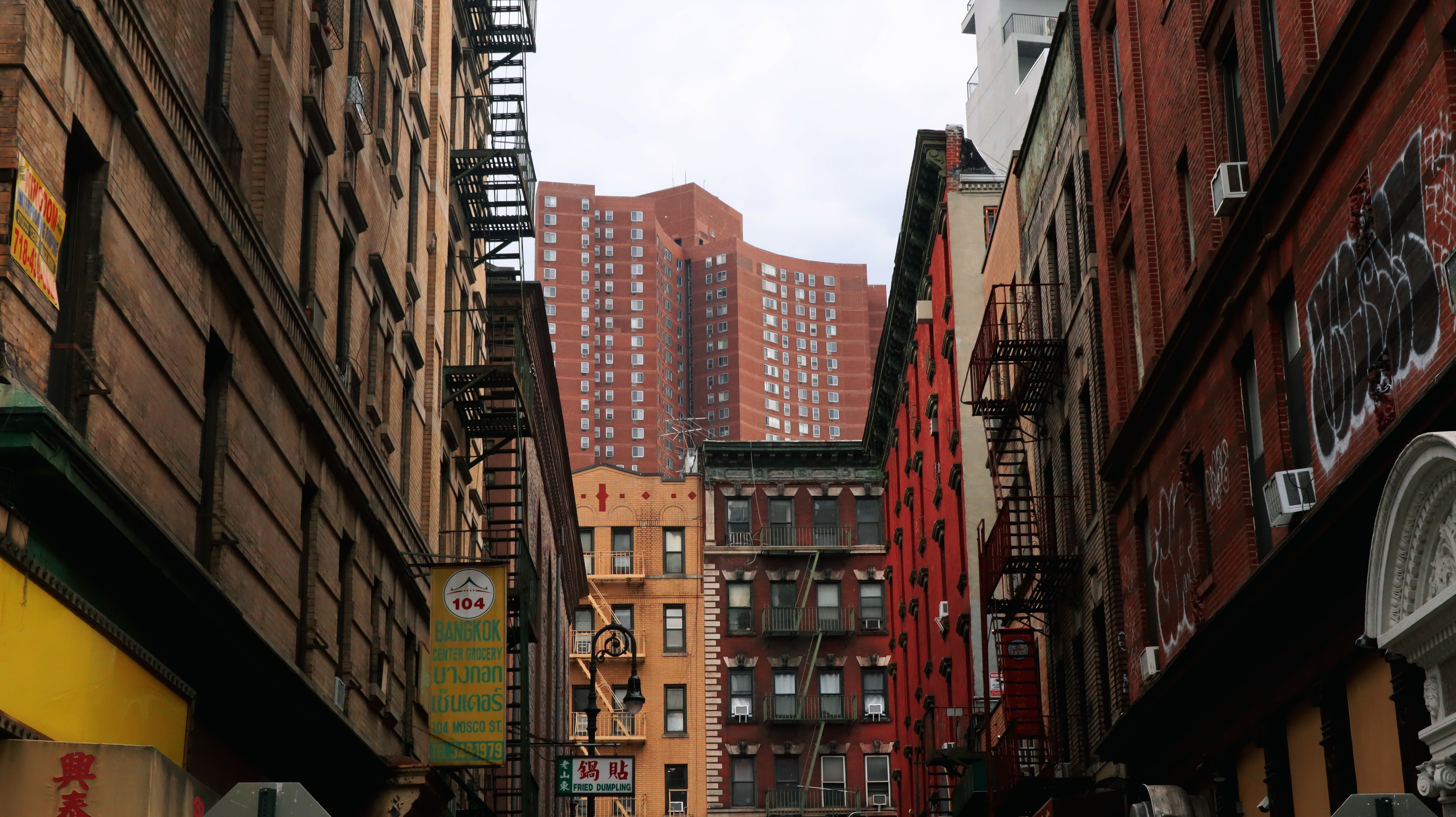 Apartment building peeking above Mosco Street