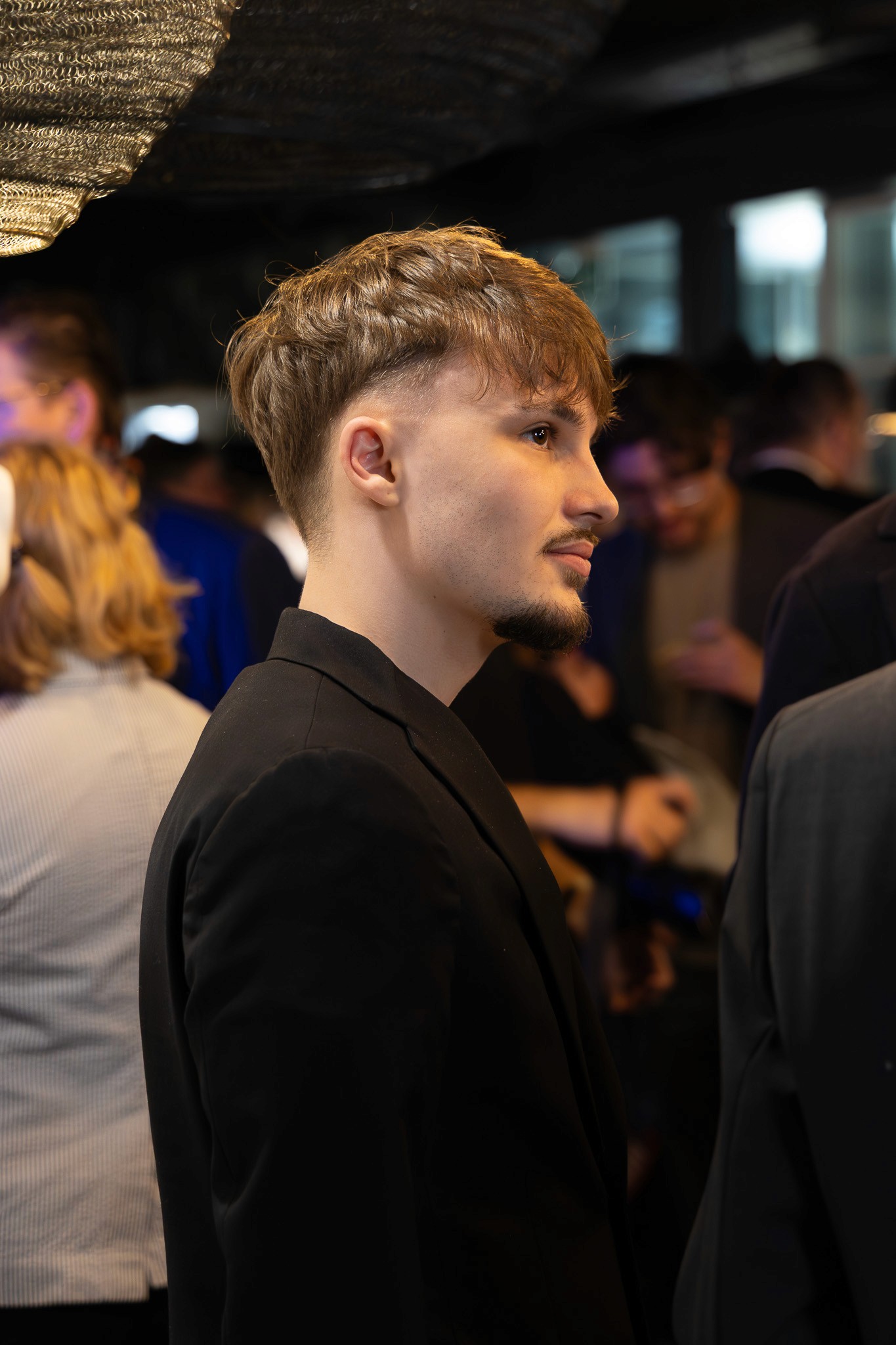 Young attendee at a blockchain networking event in Zug.