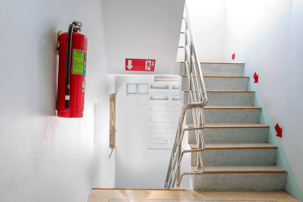 man checking a fire extinguisher