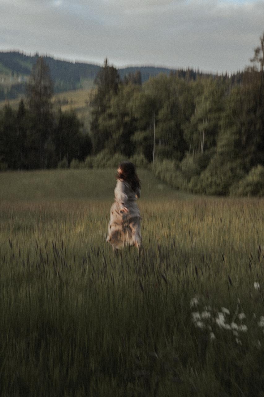 Fashion photoshoot with a woman posing in a dress