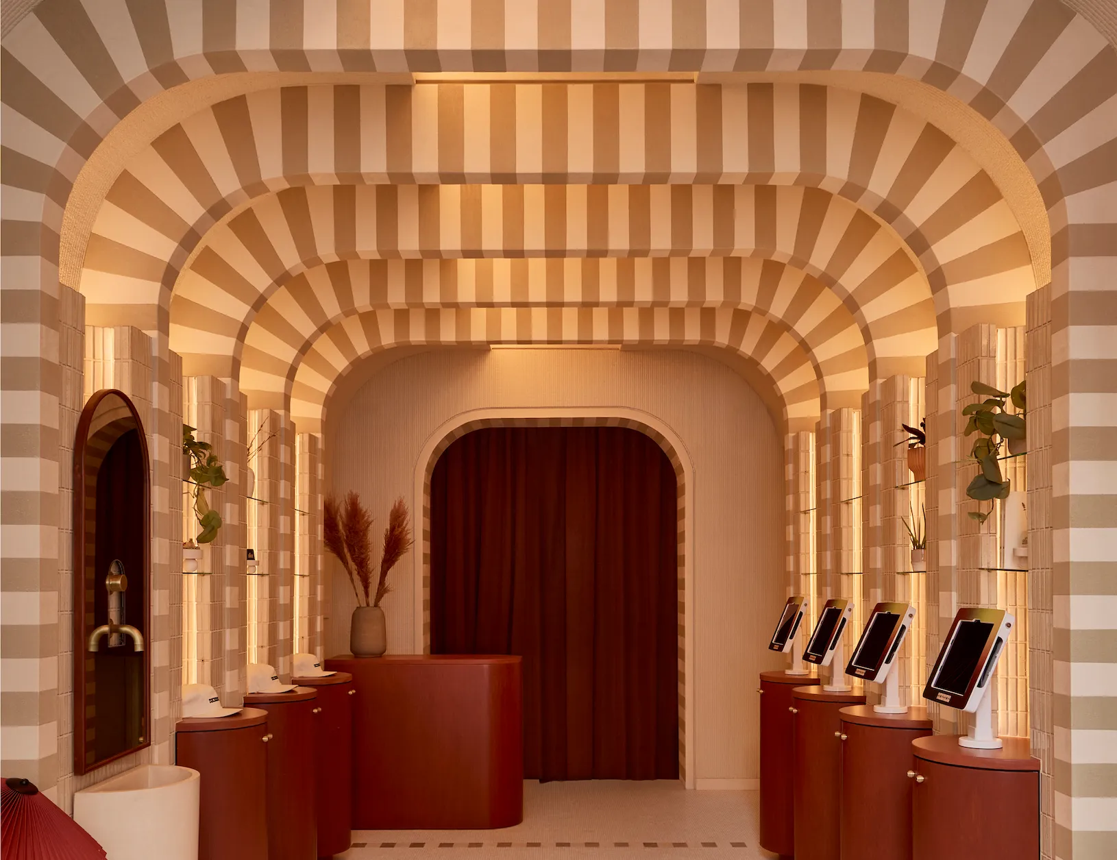 Softly uplit barrel vaulted ceiling in hotel lobby and check in area