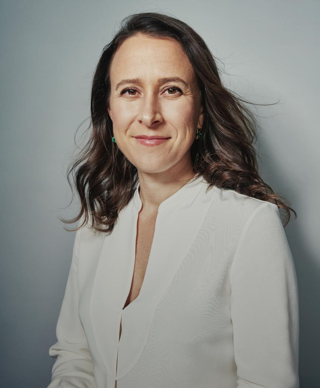 A young man surfing on the Malibu coastline.