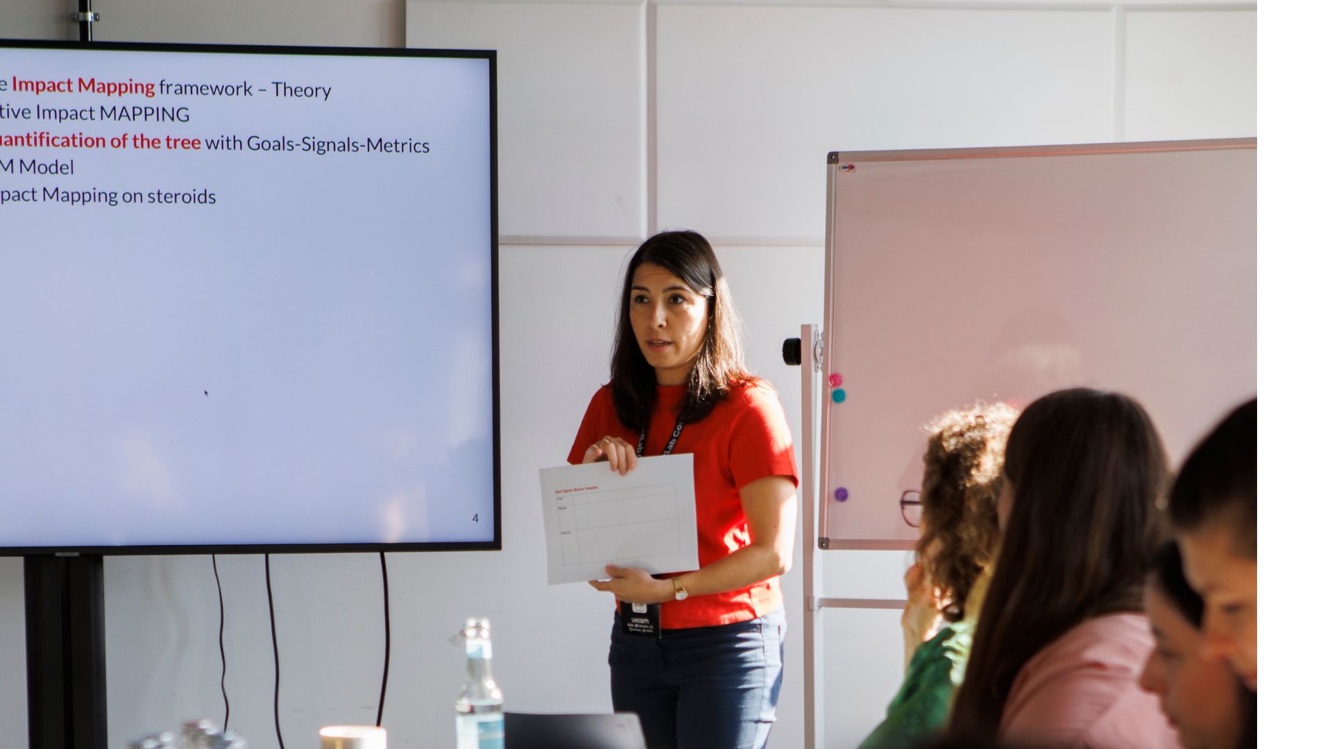 person sitting on grass and using phone