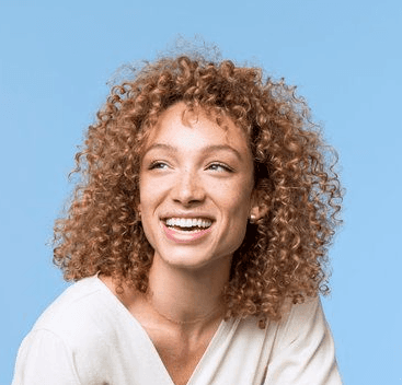 a man with a goatee smiles at the camera