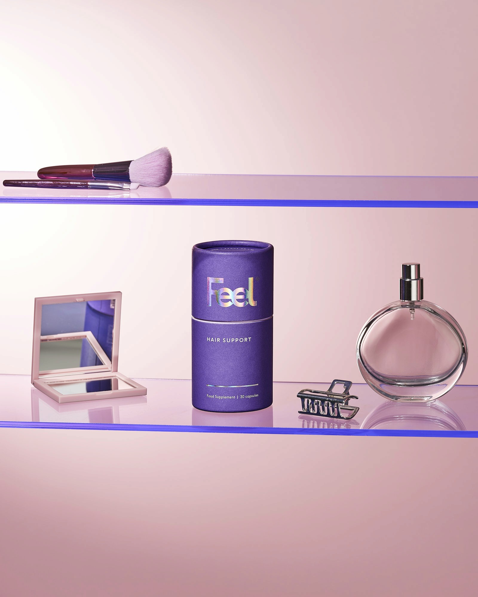 A pink shelf displays various beauty products, including a bottle, a jar, and a compact.