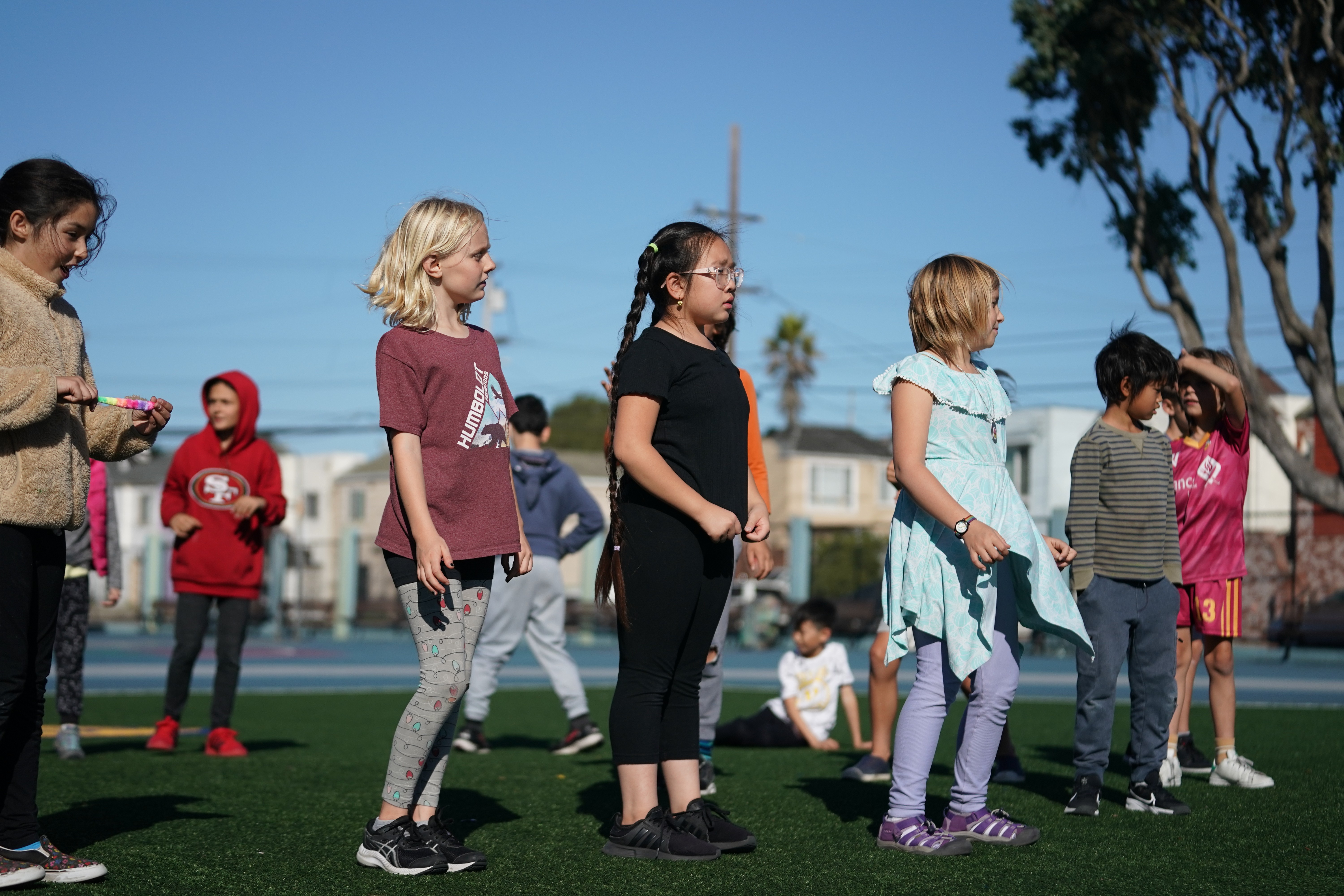 Youth dancers building confidence and stage presence in K-pop dance workshop