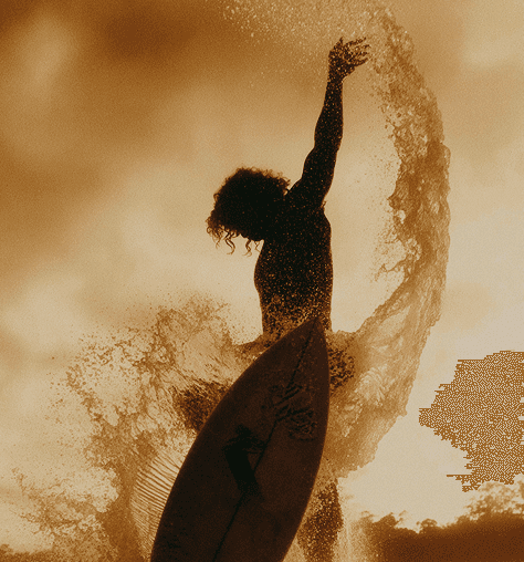 A man enjoying surfing in the ocean, gliding on a wave with sunlight reflecting on the water.