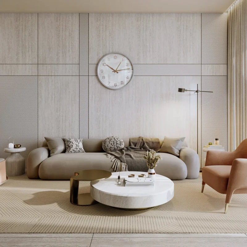 Living room at Derby Heights, including a white wall, a sofa, a coffee table, and a clock on the wall.
