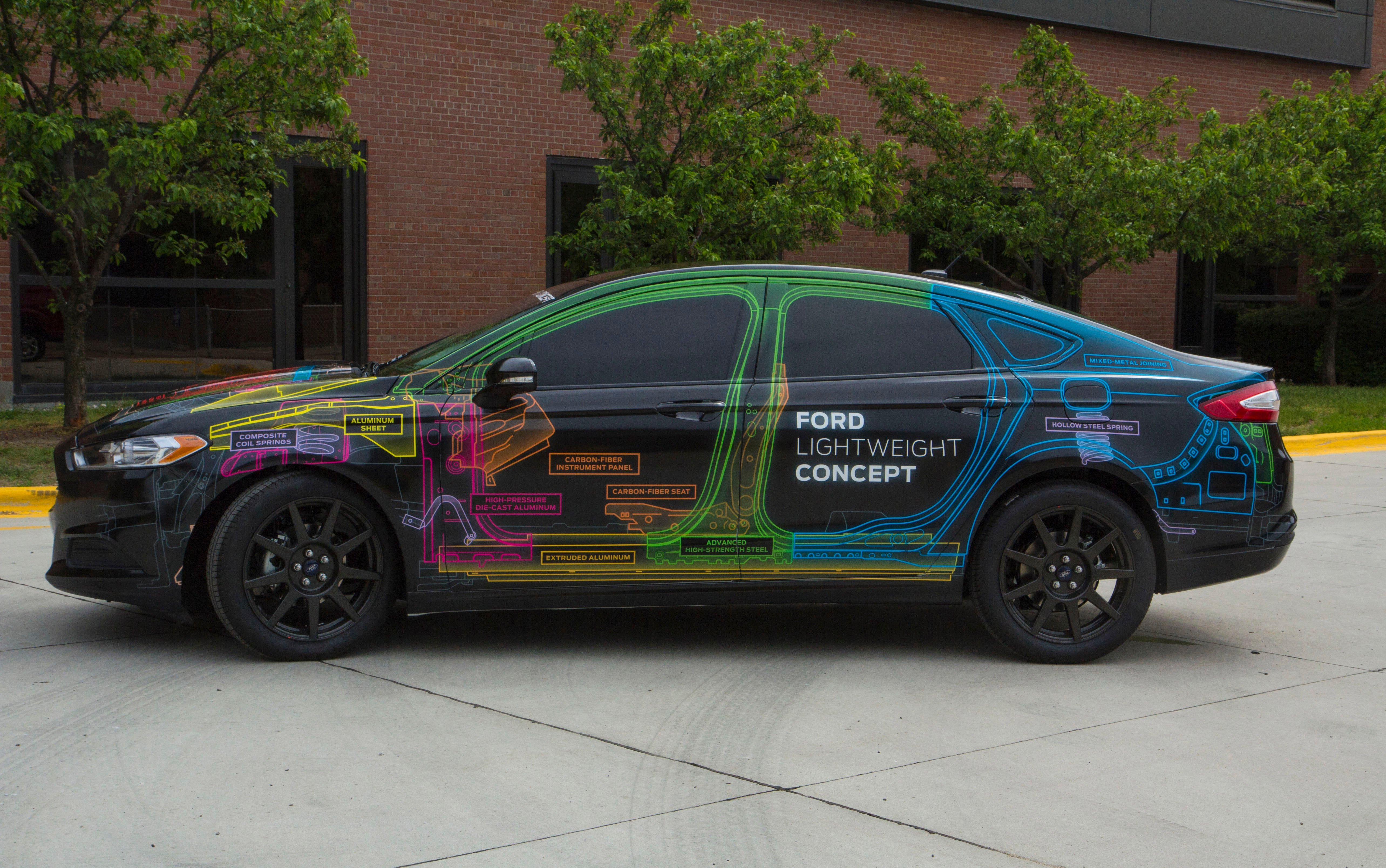 A car with a digital illustration showing internal mechanical and structural designs.