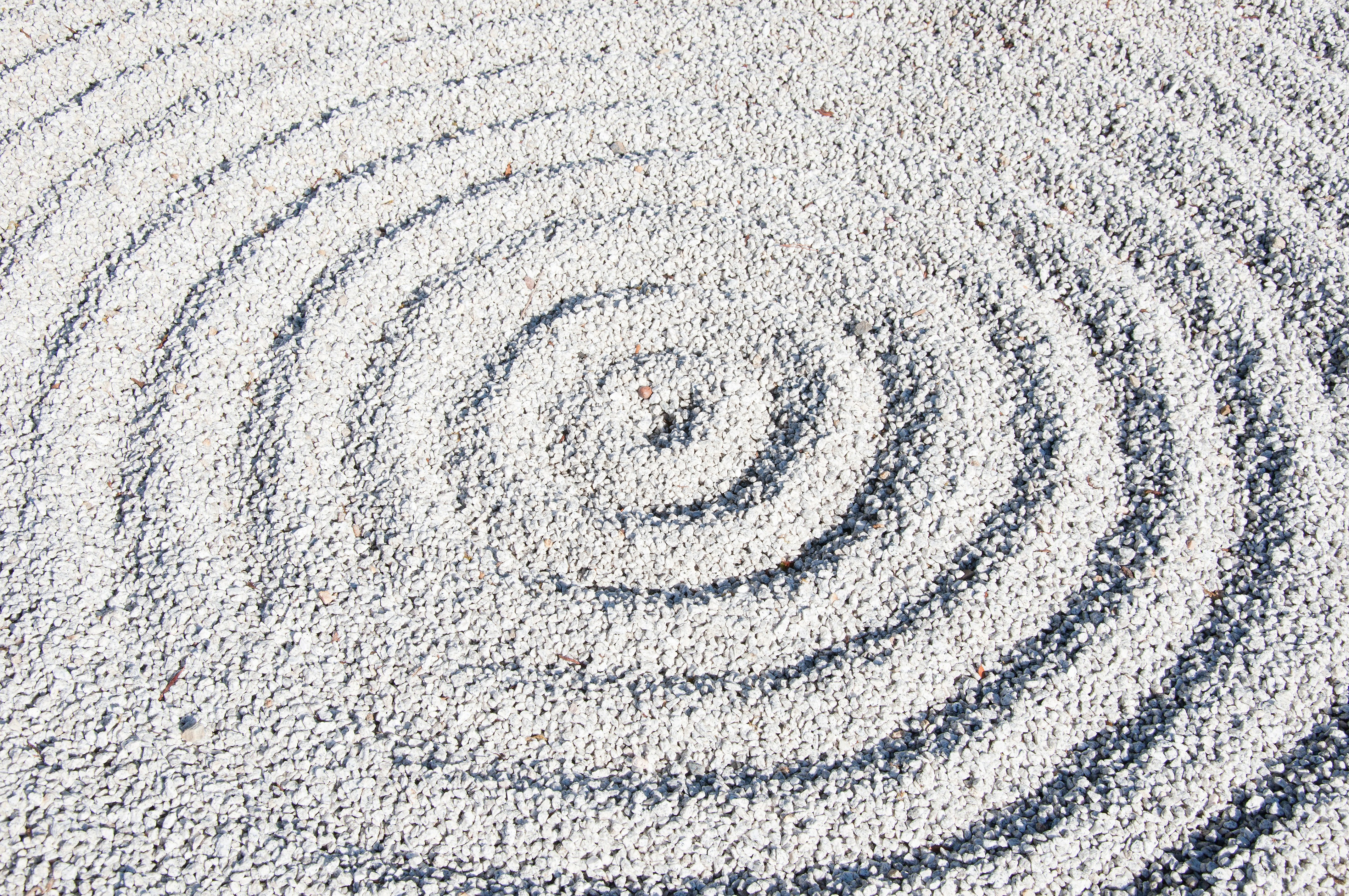 White gravel raked into concentric circles.