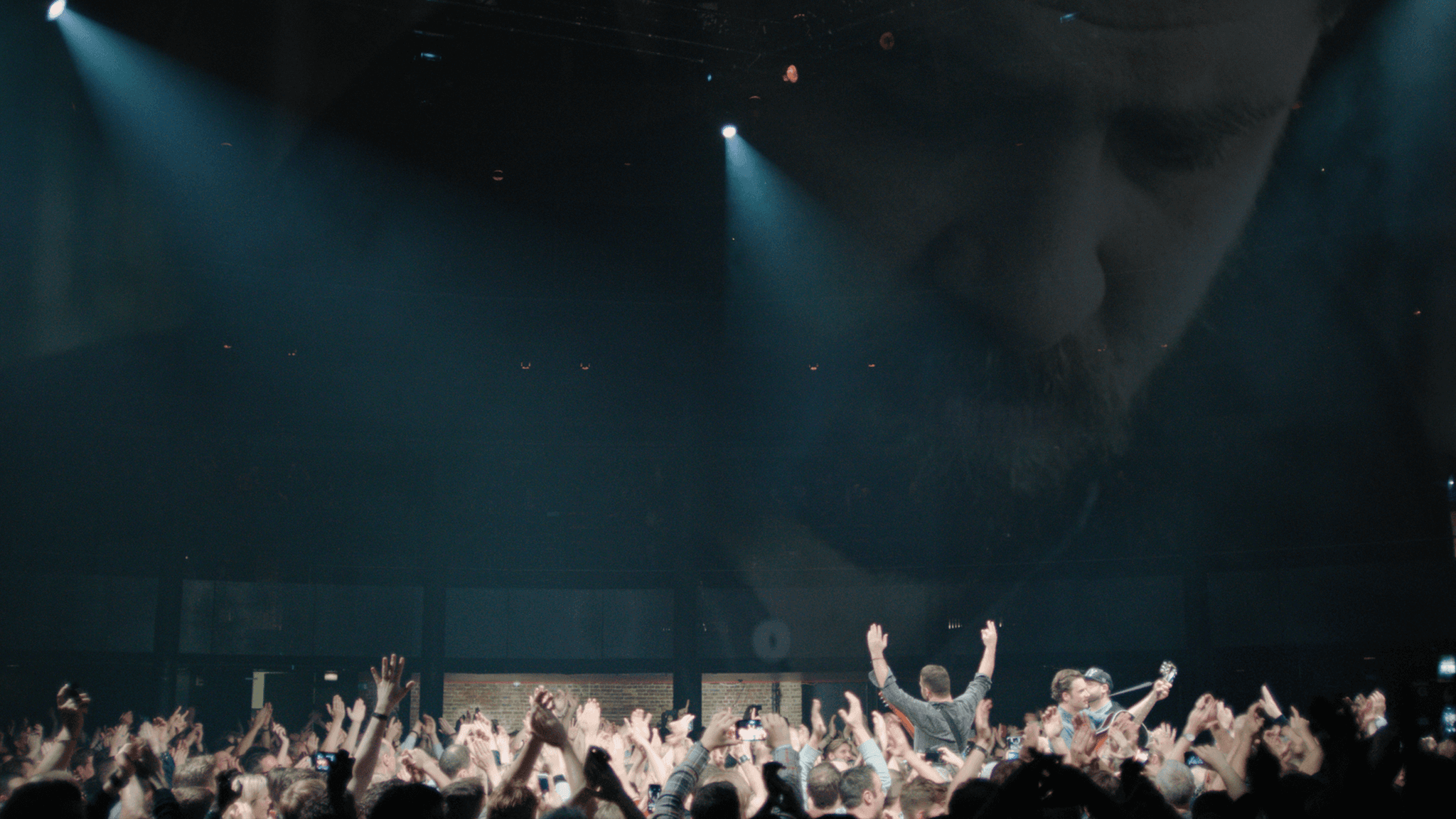 Streetside billboard with flyposters of the Batch.Works brand and illustrations