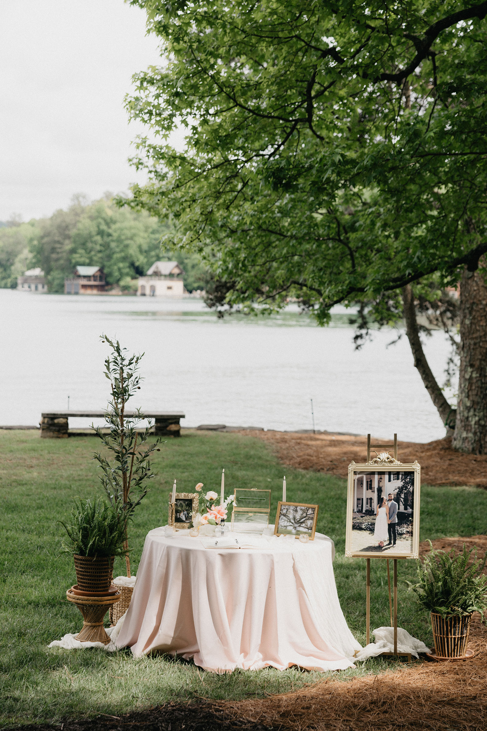 Bride and groom standing beneath a floral ceremony arch at Lake Hartwell Private Estate.