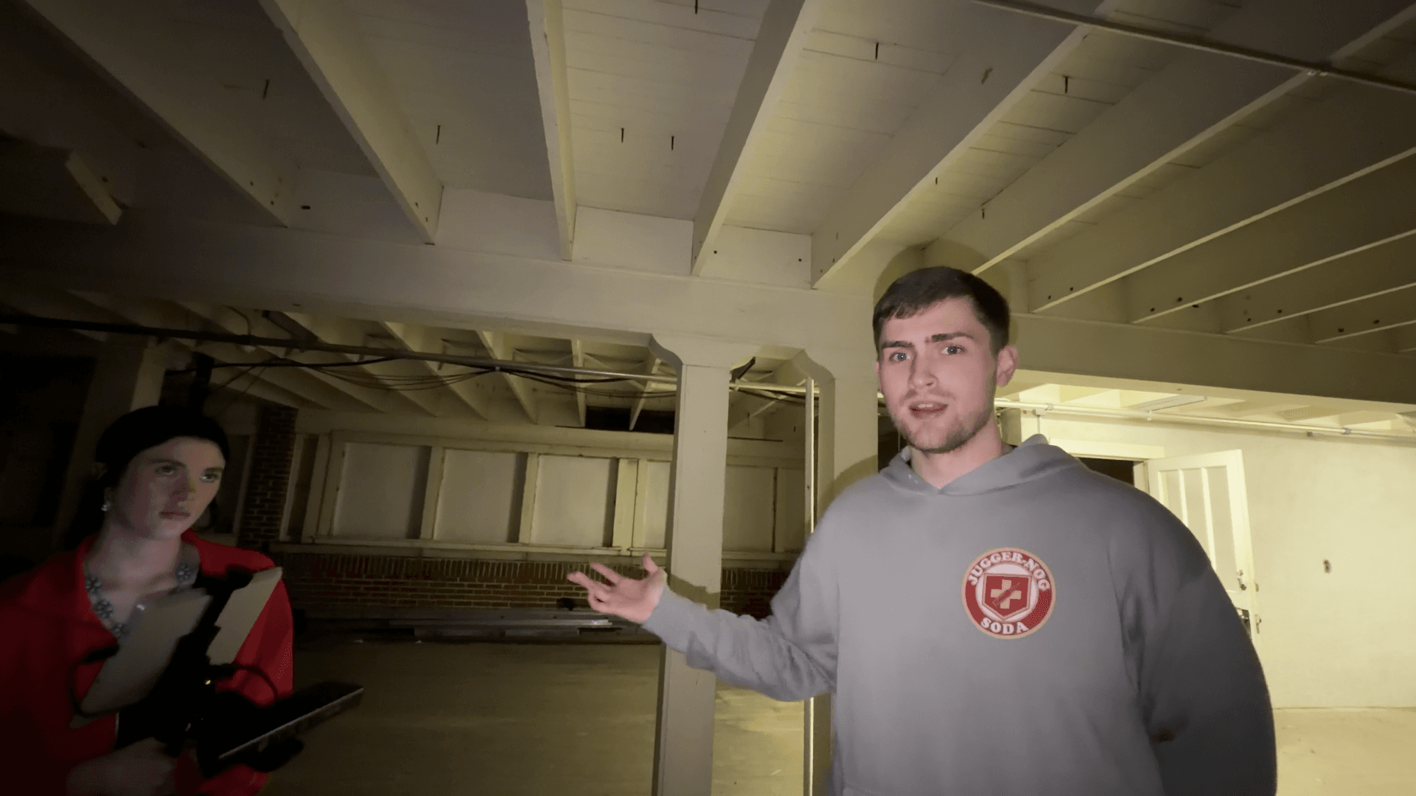 Investigators stand inside a dimly lit historic building during a paranormal investigation in Haunted Arkansas Season 2.
