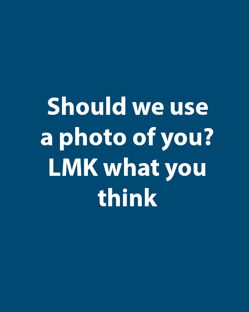three men laughing while looking in the laptop inside room