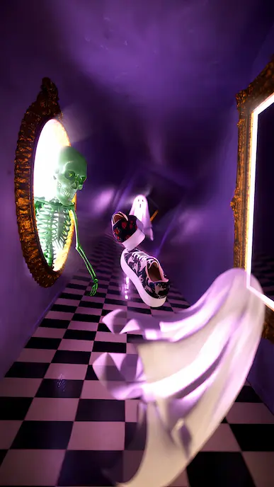 A surreal purple hallway with a checkered floor, featuring a green skeleton emerging from a mirror, floating ghosts, and a pair of levitating sneakers