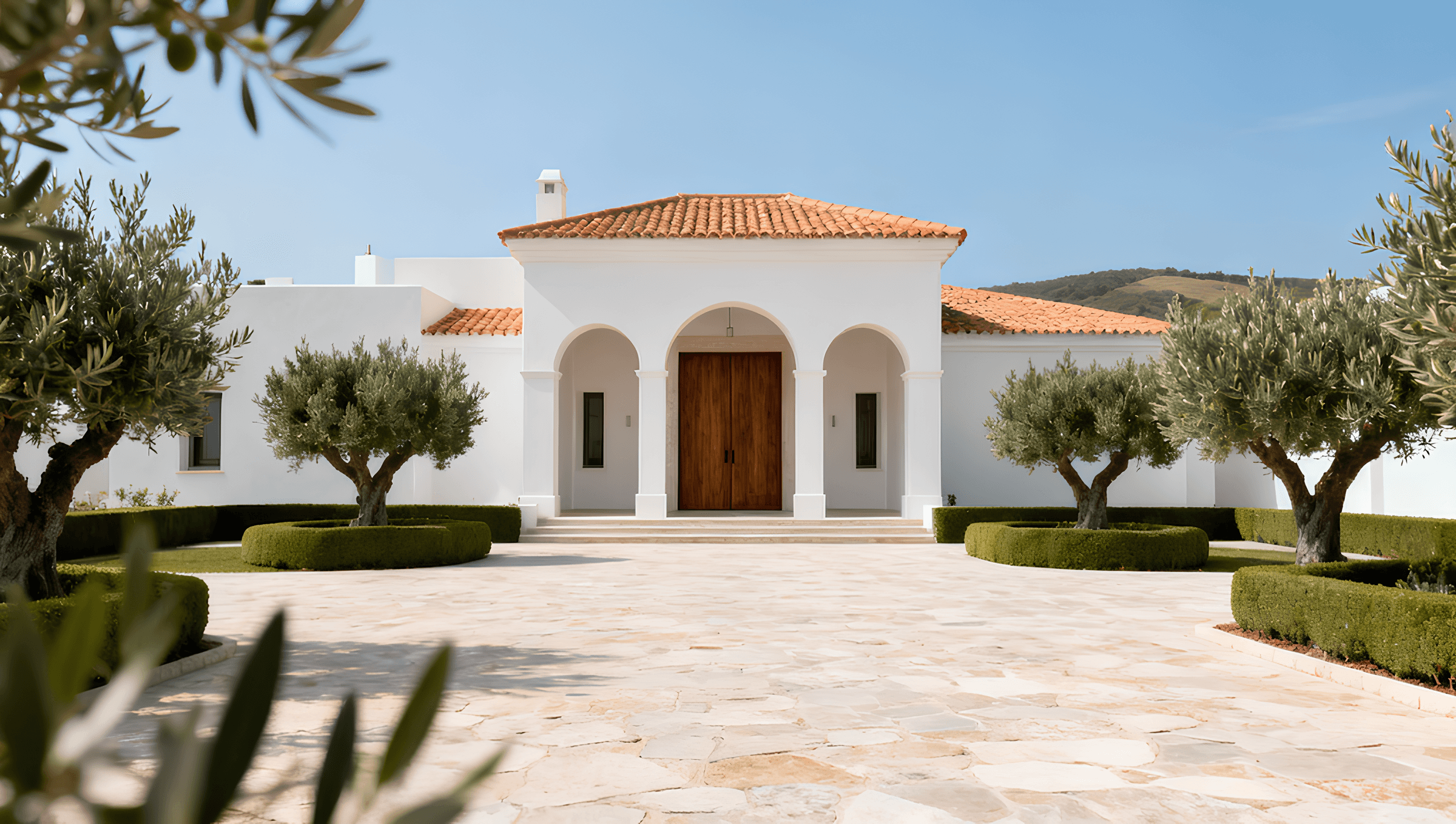 Mediterranean courtyard garden with stone steps and natural landscaping