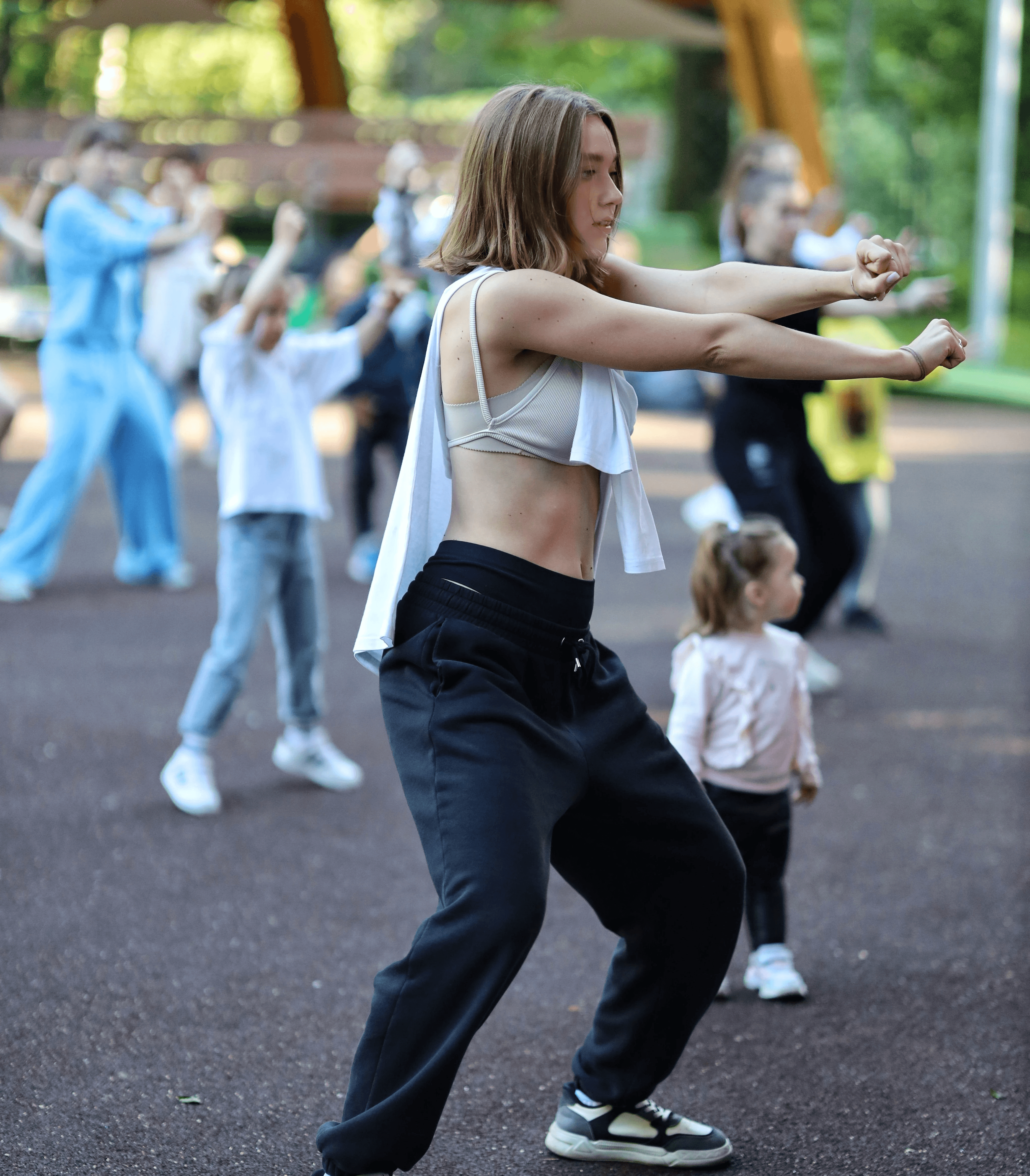 adults-and-children-engaged-in-an-energetic-group-dance-exercise-outdoors-in-a-c - dmitry-ovsyannikov (pexels)