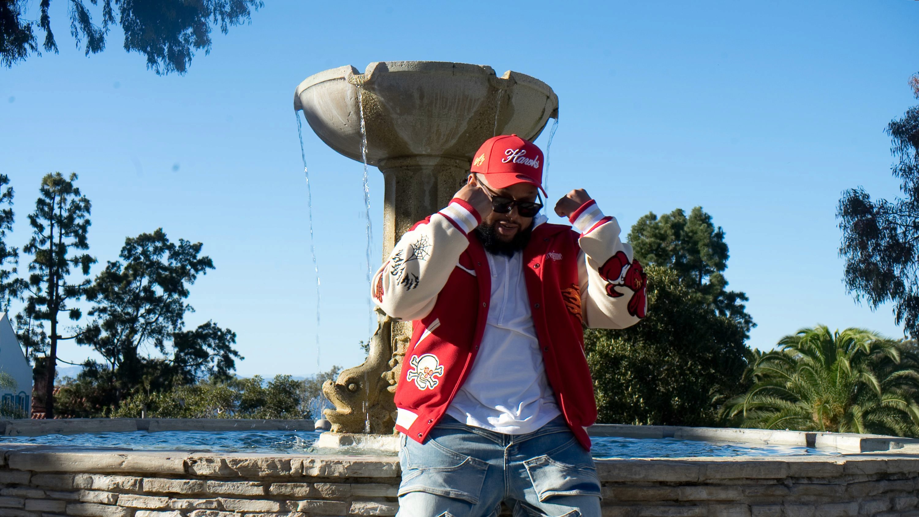 Man rapping into microphone on stage