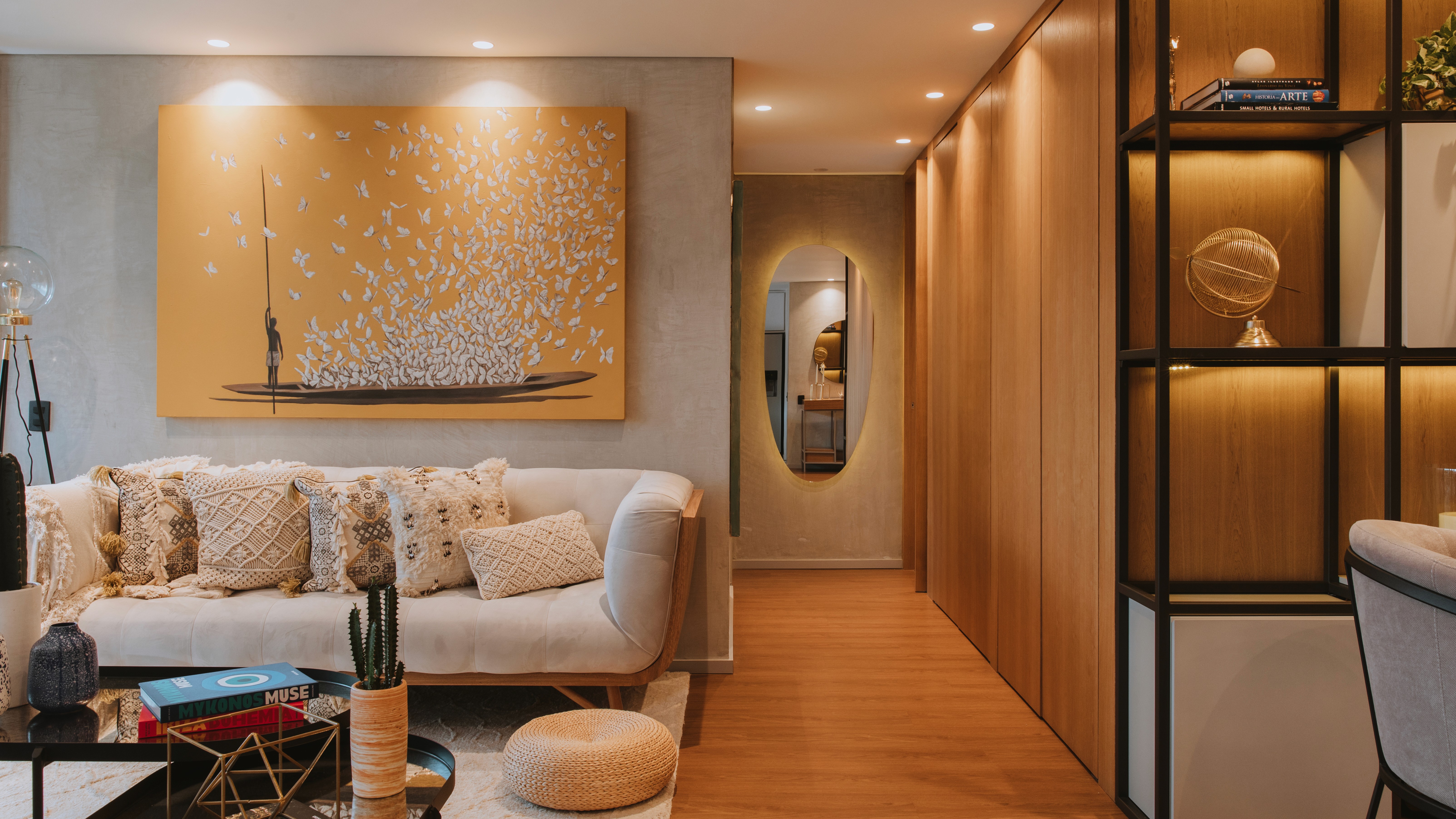 Double-height interior with flowing sculptural forms and warm raking light