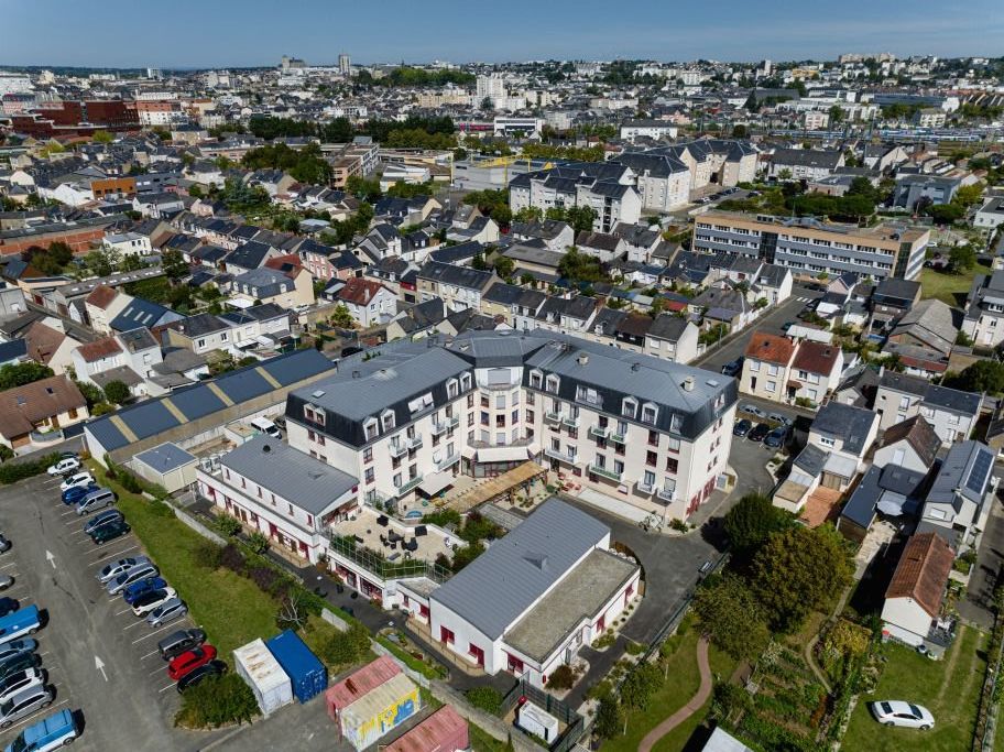 Aerial drone photograph of residence campus showing building layout	courtyards	and parking areas